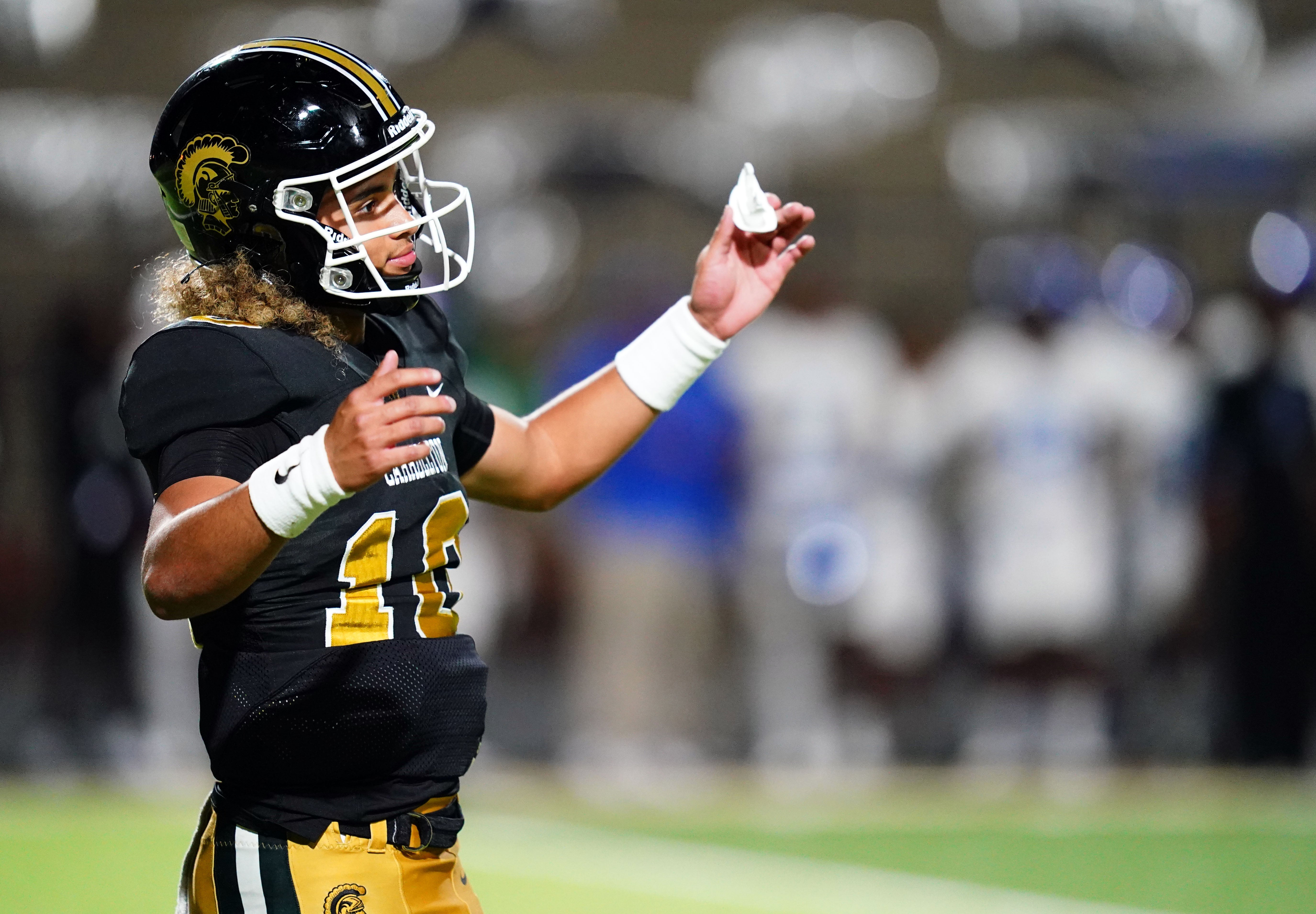 Carrollton Trojans quarterback Julian Lewis (10) reacts to a play against the Westlake Lions during the first half at Grisham Stadium. The 15-year-old Carrollton High student has already committed to playing for the University of Southern California Trojans and has been considered one of the top high school quarterback prospects.