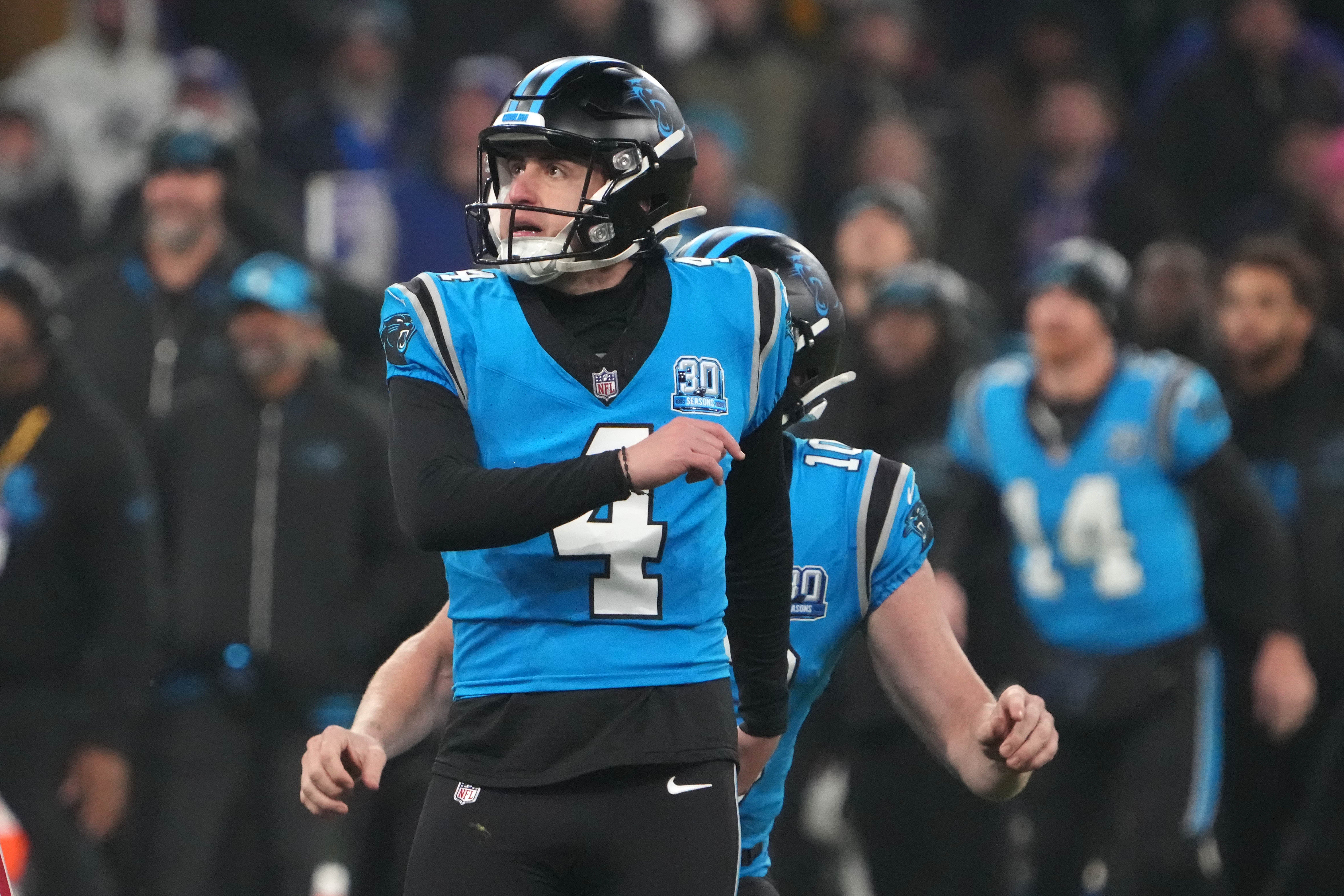 Nov 10, 2024; Munich, Germany; Carolina Panthers place kicker Eddy Pineiro (4) kicks a 36-yard field goal in overtime against the New York Giants during the 2024 NFL Munich Game at Allianz Arena.