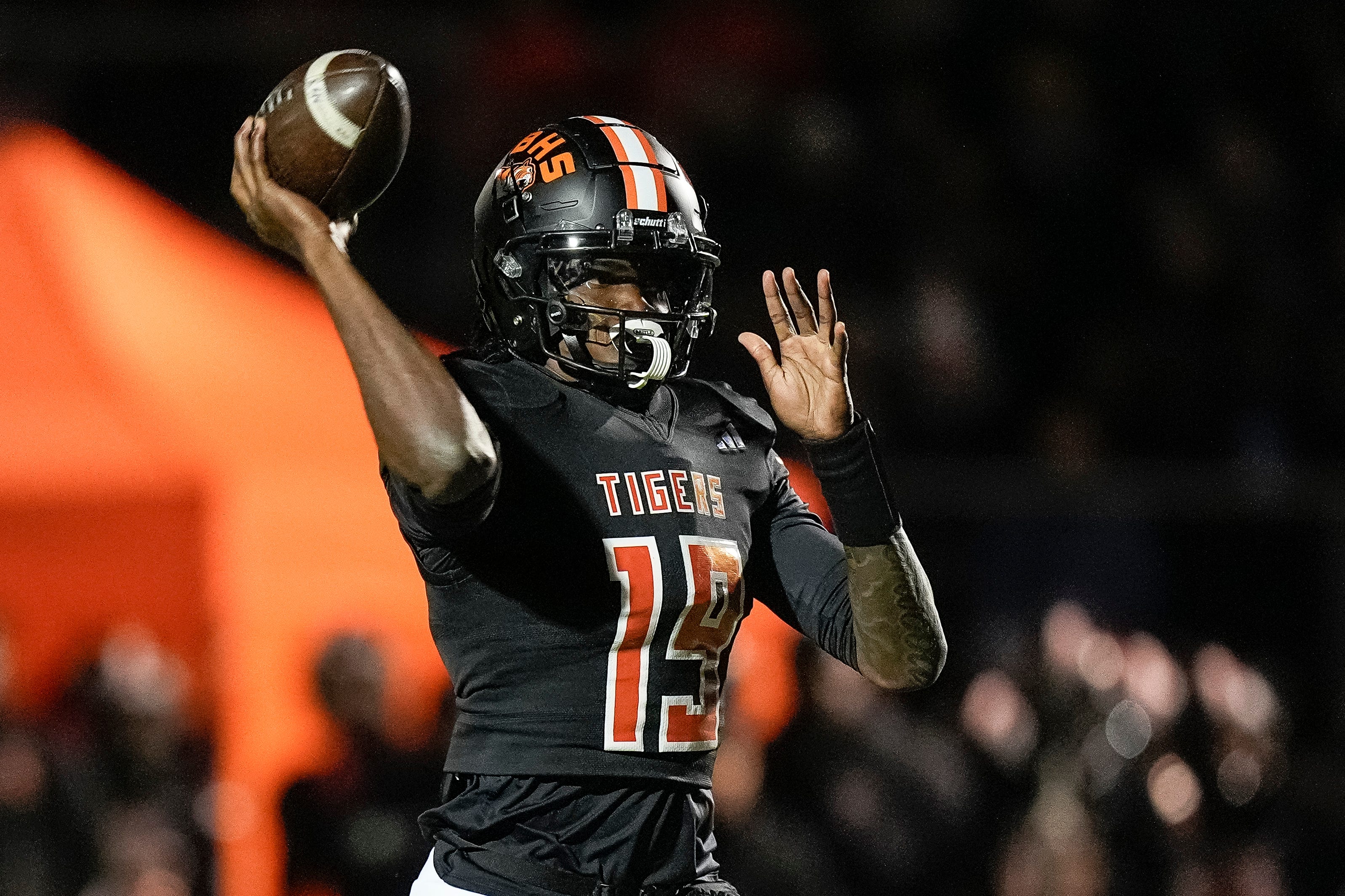Belleville quarterback Bryce Underwood makes a pass against Saline during the first half of a district final playoff game at Belleville High School in Belleville on Friday, Nov. 8, 2024.