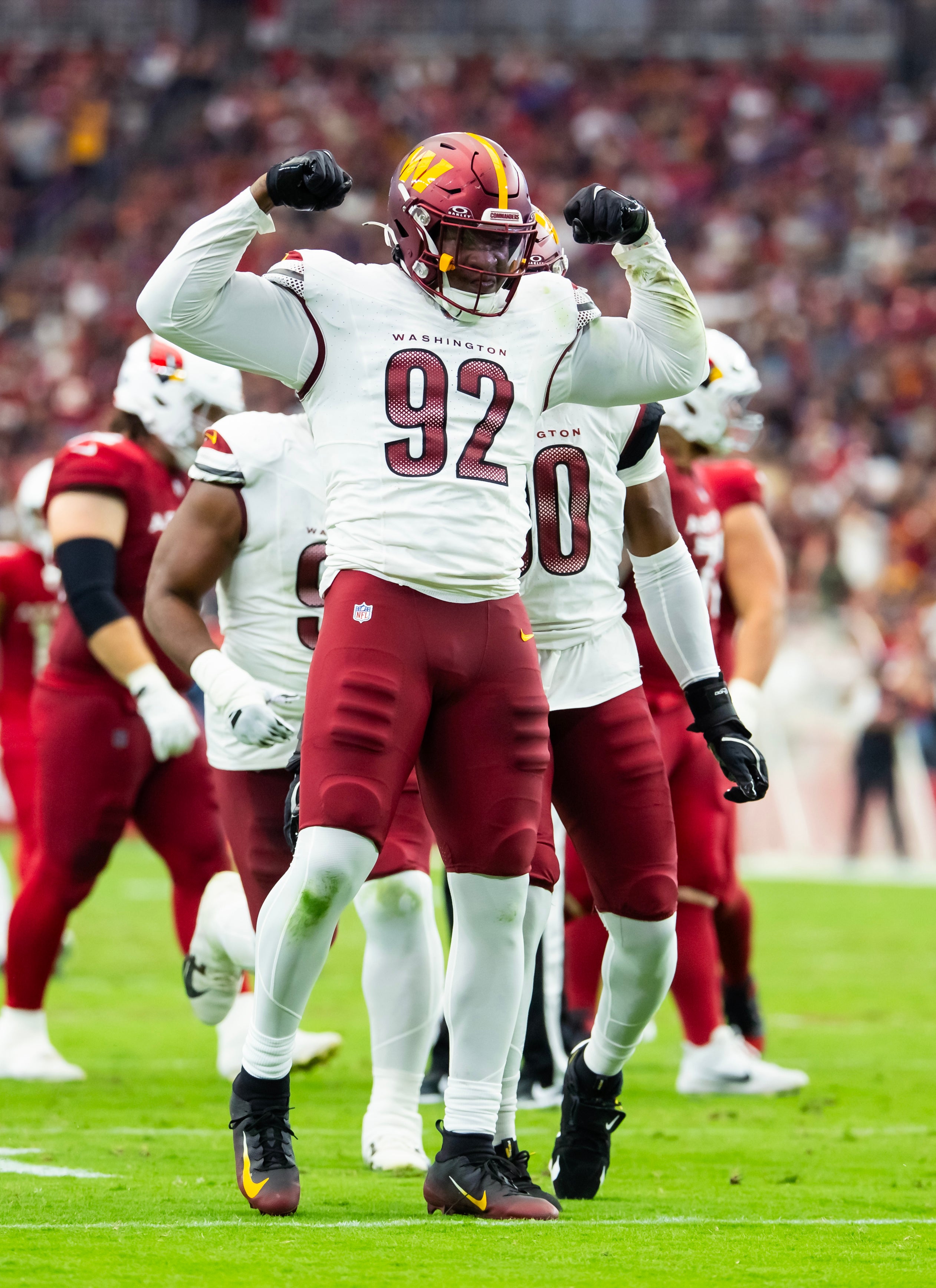Sep 29, 2024; Glendale, Arizona, USA; Washington Commanders defensive end Dorance Armstrong (92) celebrates after sacking Arizona Cardinals quarterback Kyler Murray (not pictured) in the first half at State Farm Stadium.