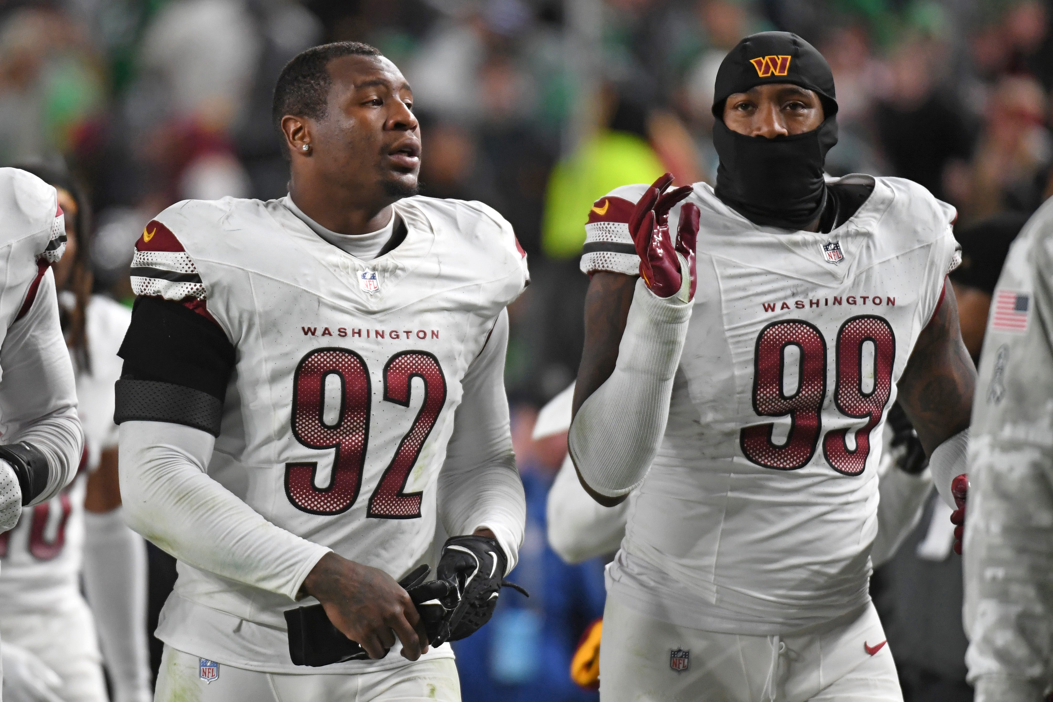 Nov 14, 2024; Philadelphia, Pennsylvania, USA; Washington Commanders defensive end Dorance Armstrong (92) and defensive end Clelin Ferrell (99) against the Philadelphia Eagles at Lincoln Financial Field.