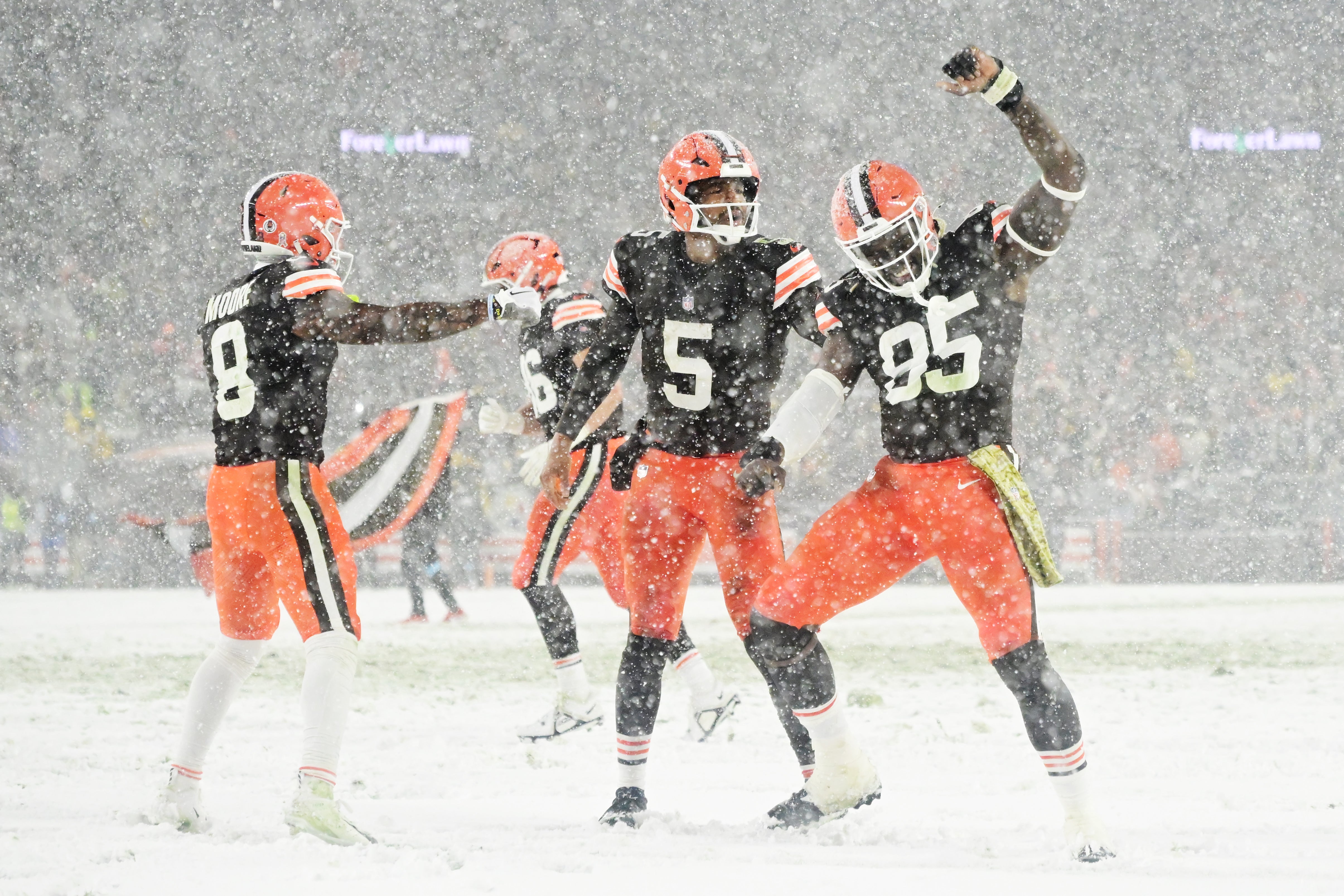 Nov 21, 2024; Cleveland, Ohio, USA; Cleveland Browns wide receiver Elijah Moore (8) and quarterback Jameis Winston (5) and tight end David Njoku (85) celebrate after Winston scored a touchdown during the second half against the Pittsburgh Steelers at Huntington Bank Field. Mandatory Credit: Ken Blaze-Imagn Images