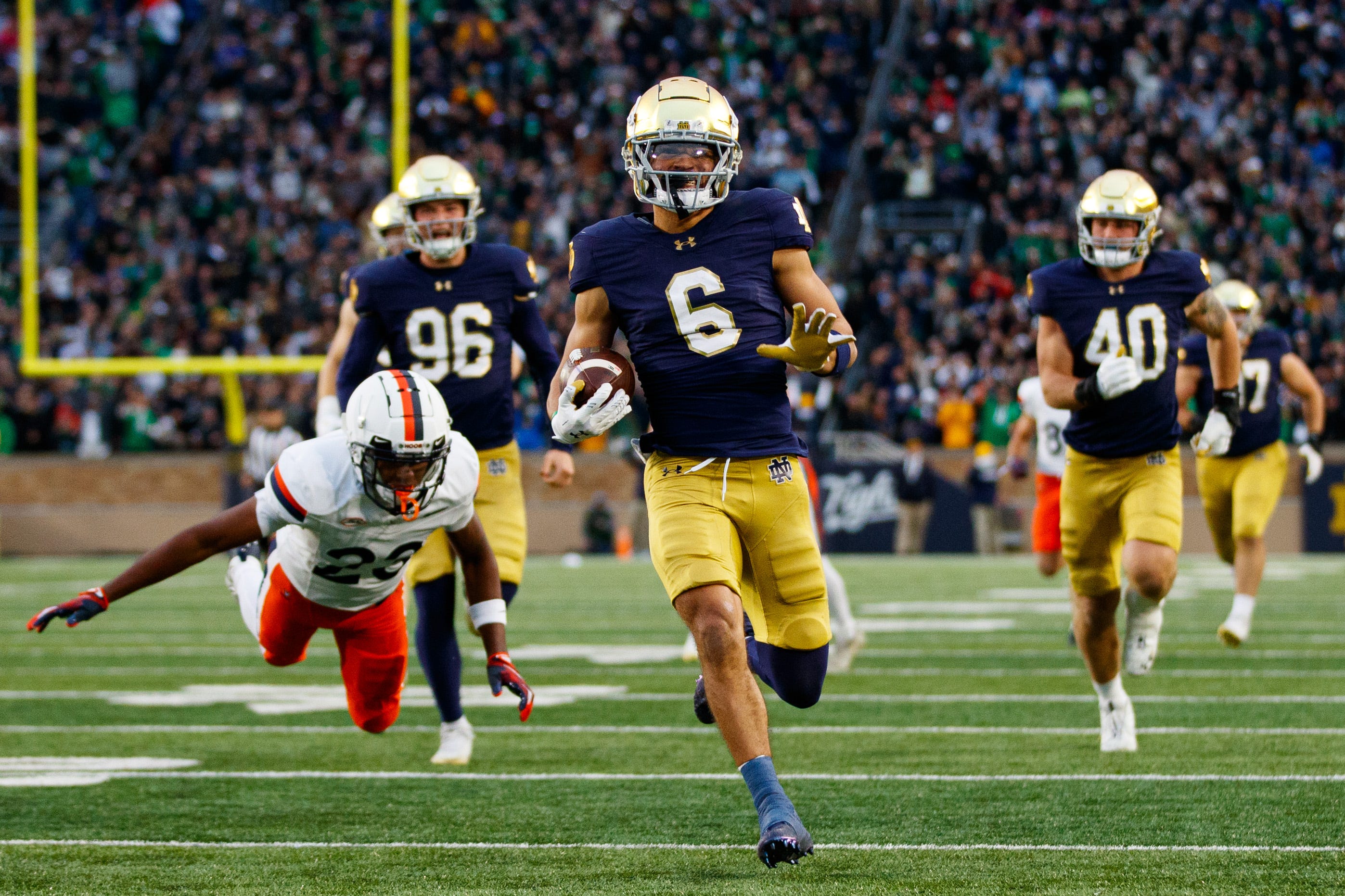 Notre Dame wide receiver Jordan Faison (6) runs the ball into the end zone for a touchdown on a fake punt play that would be later called back during a NCAA college football game against Virginia at Notre Dame Stadium on Saturday, Nov. 16, 2024, in South Bend.