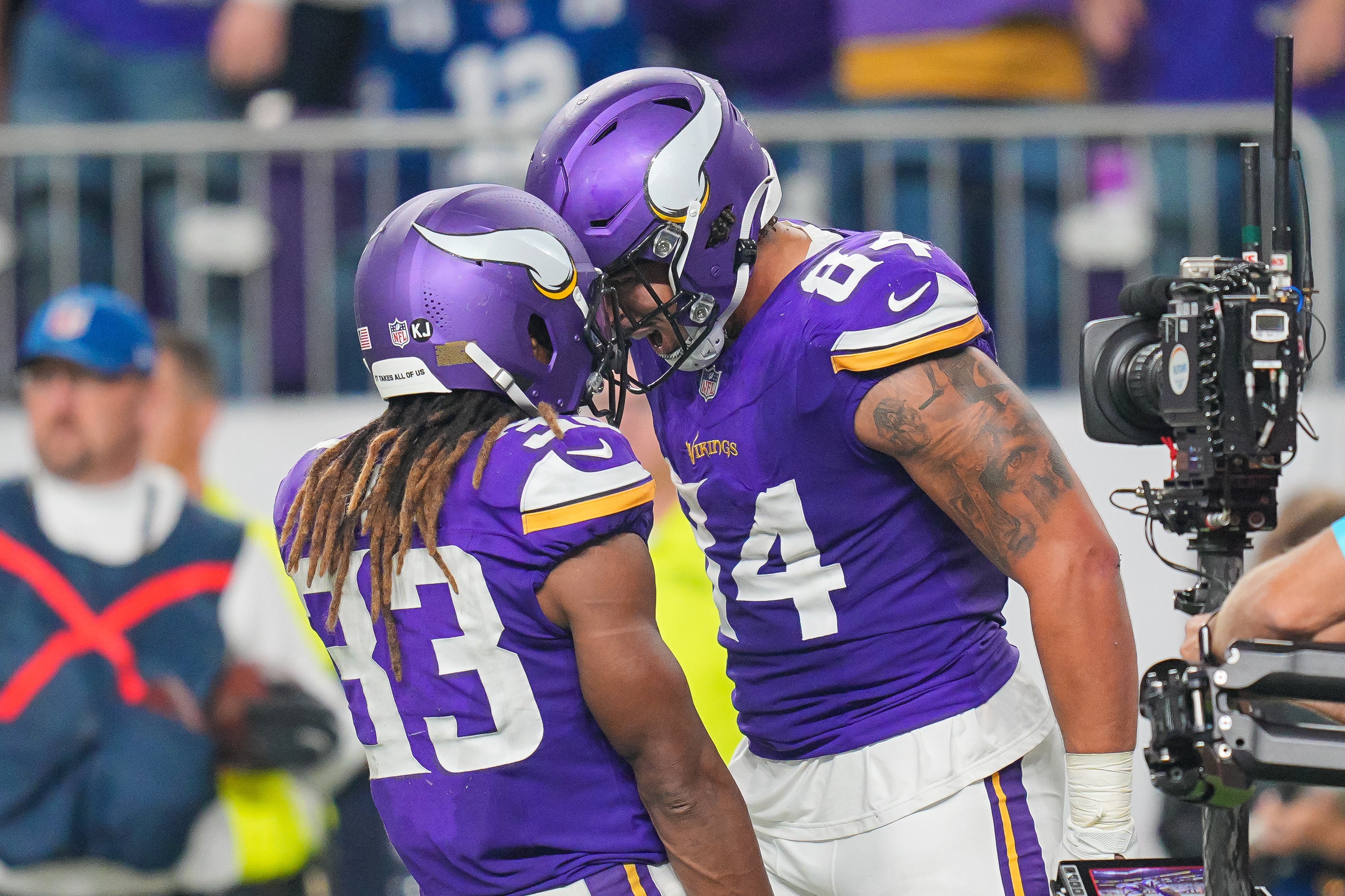 Nov 3, 2024; Minneapolis, Minnesota, USA; Minnesota Vikings tight end Josh Oliver (84) celebrates his touchdown with running back Aaron Jones (33) against the Indianapolis Colts in the fourth quarter at U.S. Bank Stadium.