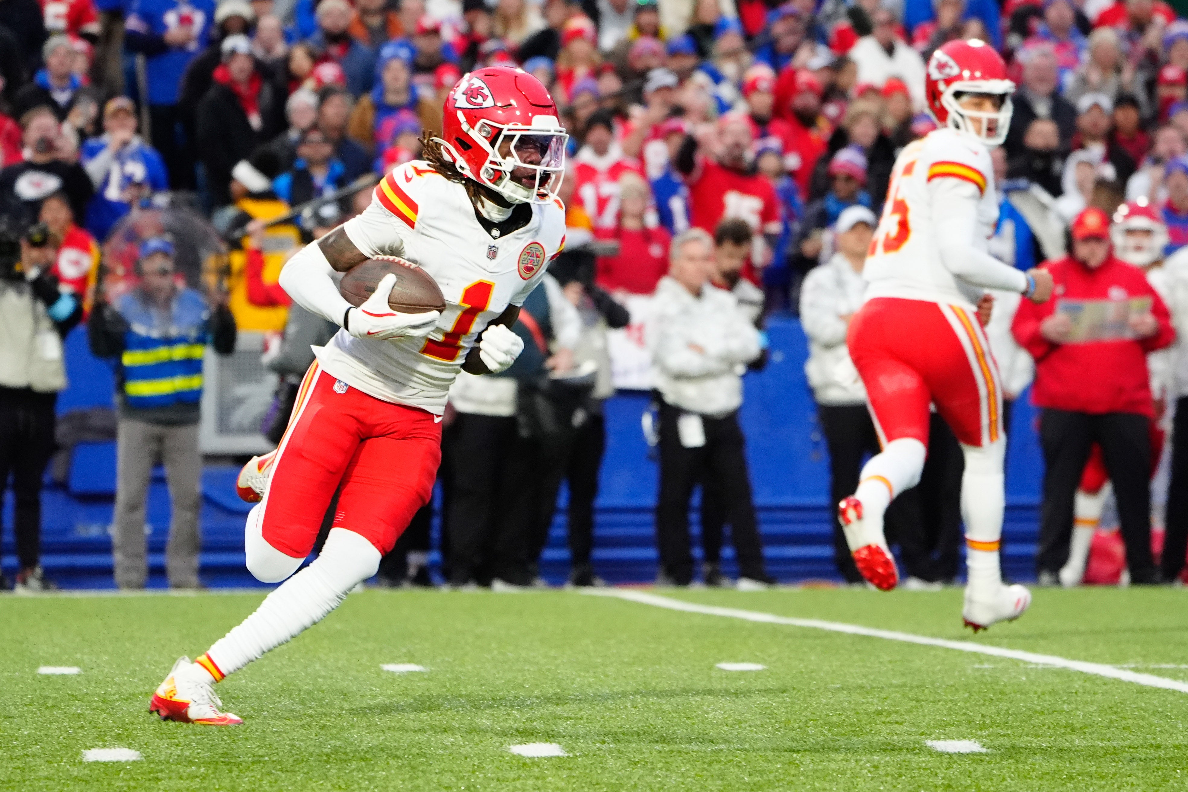 Nov 17, 2024; Orchard Park, New York, USA; Kansas City Chiefs wide receiver Xavier Worthy (1) runs with the ball against the Buffalo Bills during the first half at Highmark Stadium.
