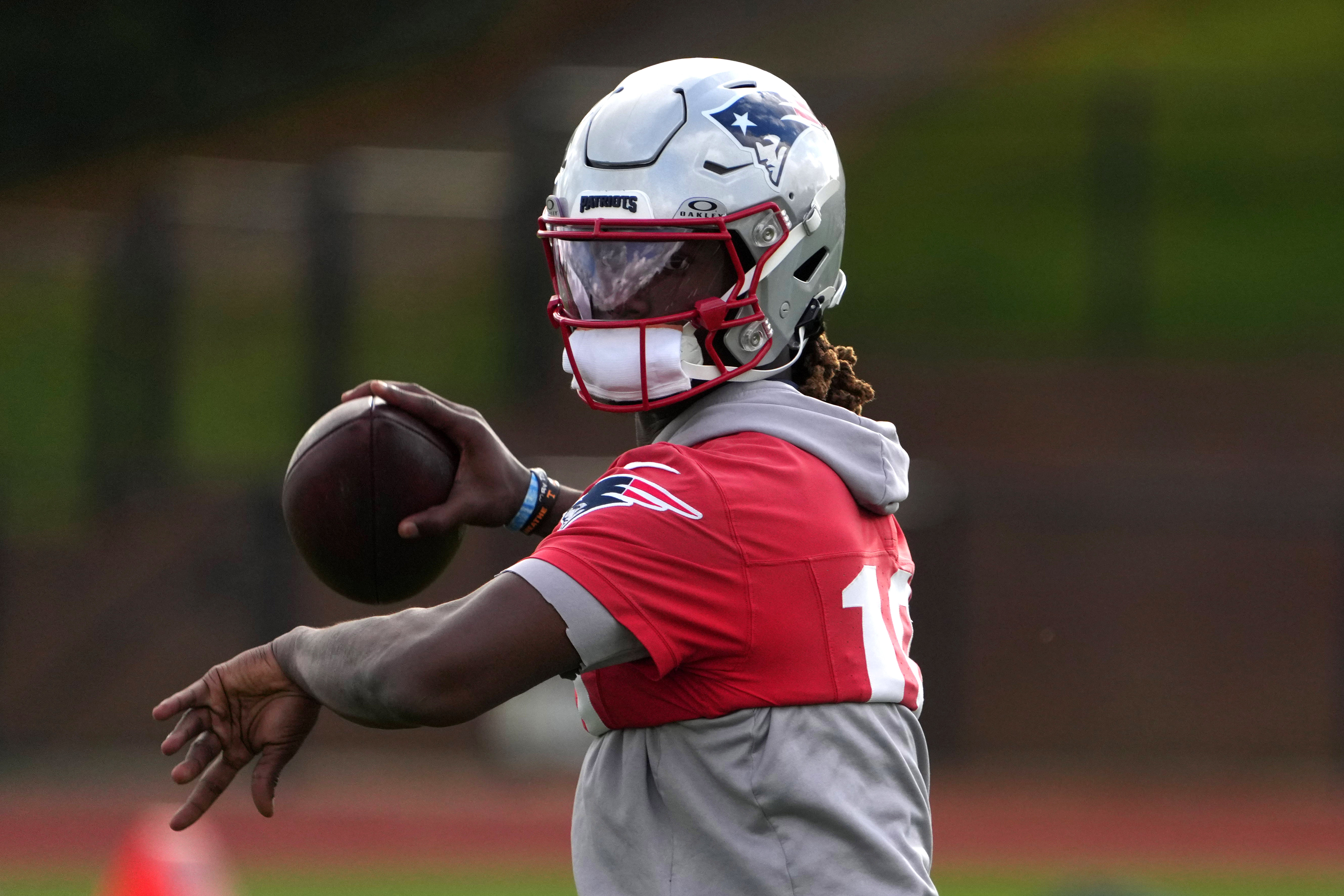 Oct 18, 2024; London, United Kingdom; New England Patriots quarterback Joe Milton III (19) throws the ball during practice at the Harrow School.
