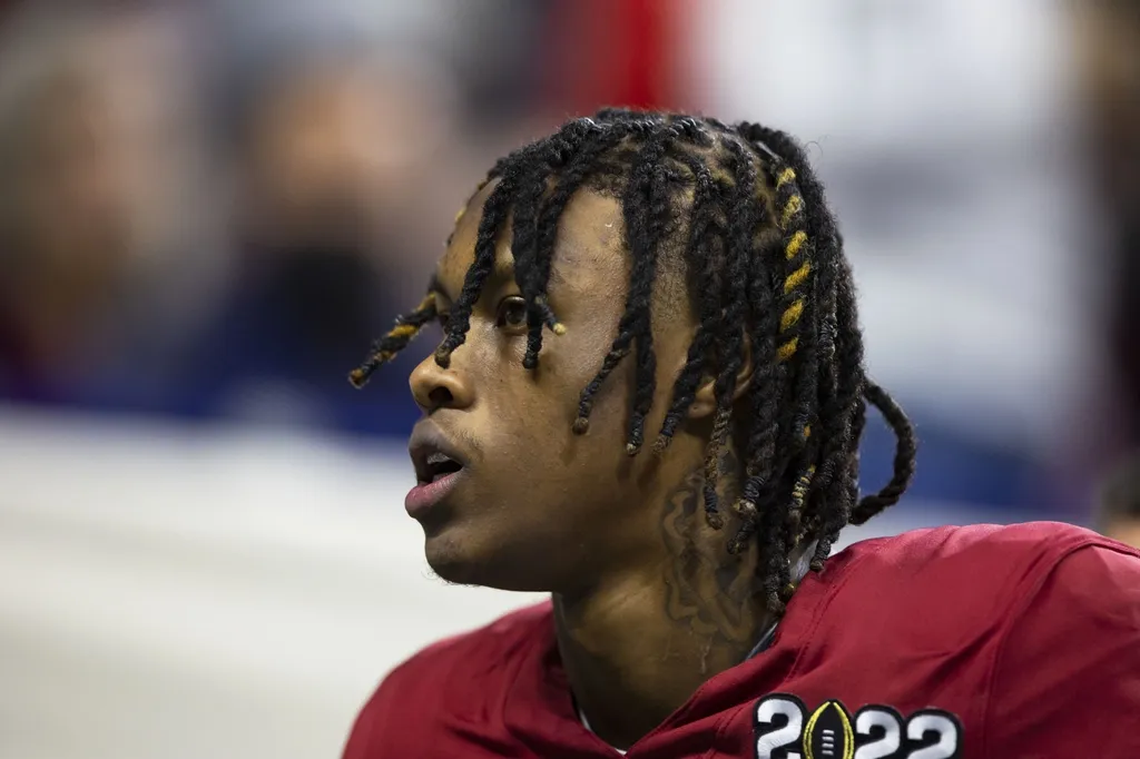 Alabama Crimson Tide wide receiver Jameson Williams (1) leaves the game after tearing his ACL against the Georgia Bulldogs in the 2022 CFP college football national championship