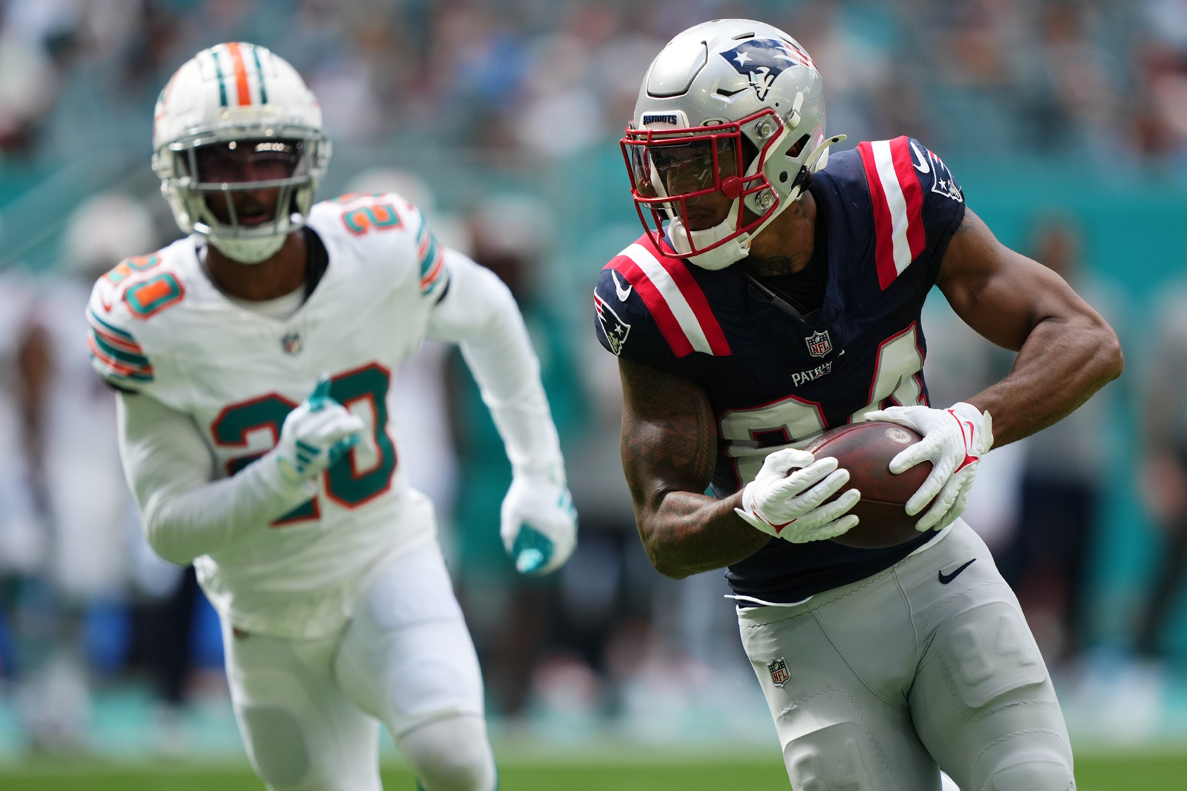 Oct 29, 2023; Miami Gardens, Florida, USA; New England Patriots wide receiver Kendrick Bourne (84) runs the ball for a touchdown against the Miami Dolphins during the first half at Hard Rock Stadium.