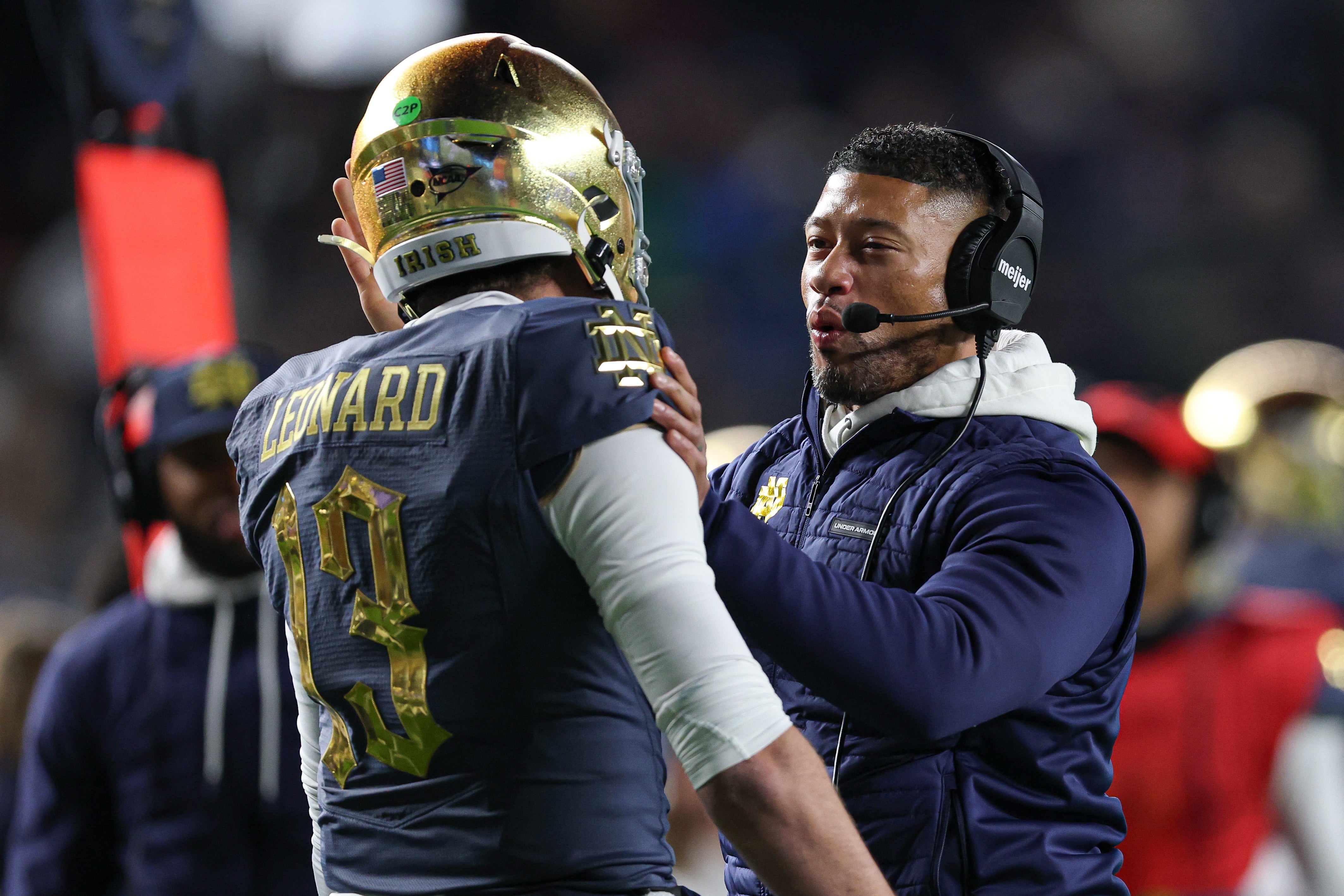 Notre Dame Fighting Irish head coach Marcus Freeman celebrates with quarterback Riley Leonard (13) after a touchdown during the first half against the Army Black Knights at Yankee Stadium.