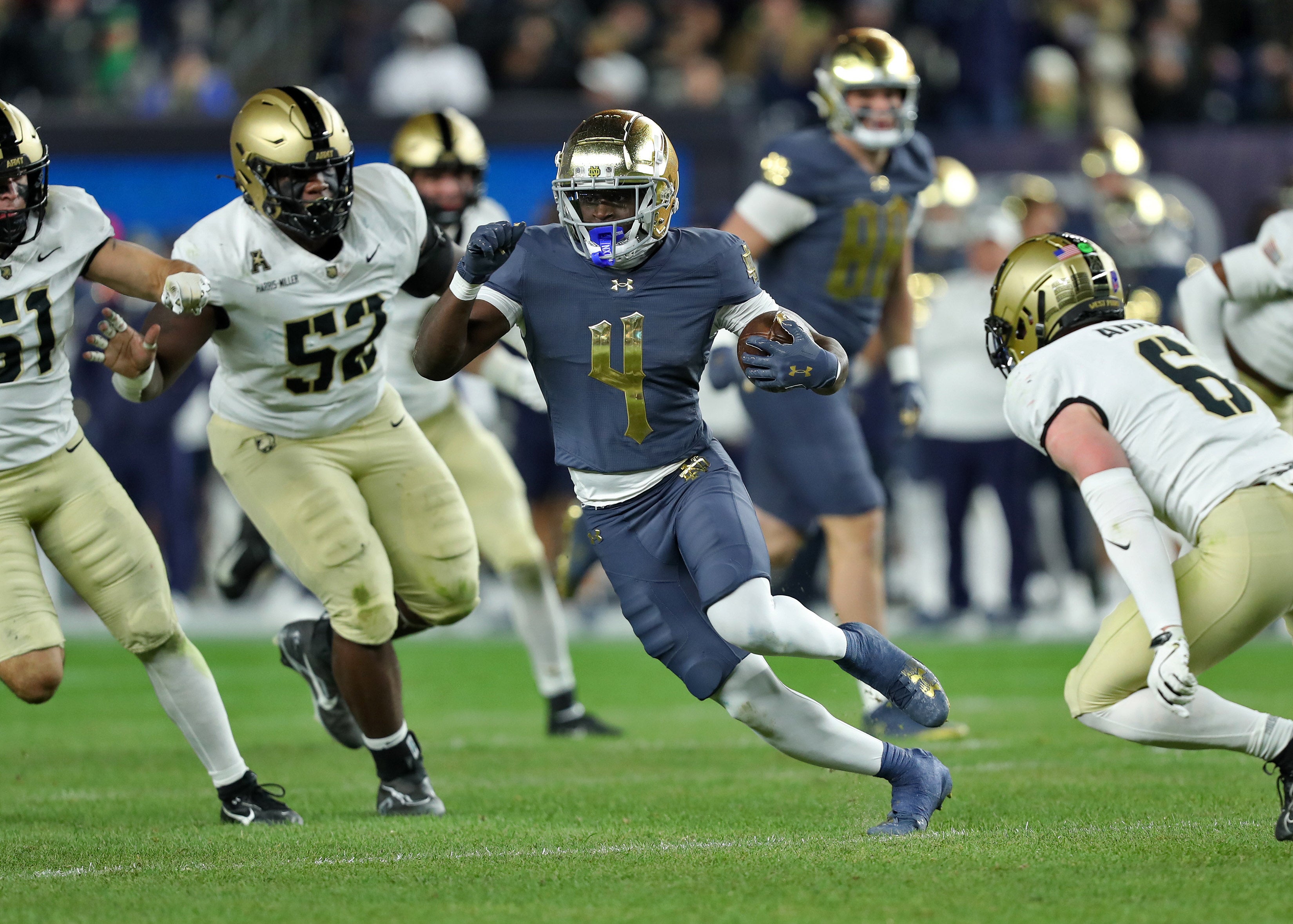 Notre Dame Fighting Irish running back Jeremiyah Love (4) runs with the ball against the Army Black Knights during the first half at Yankee Stadium.