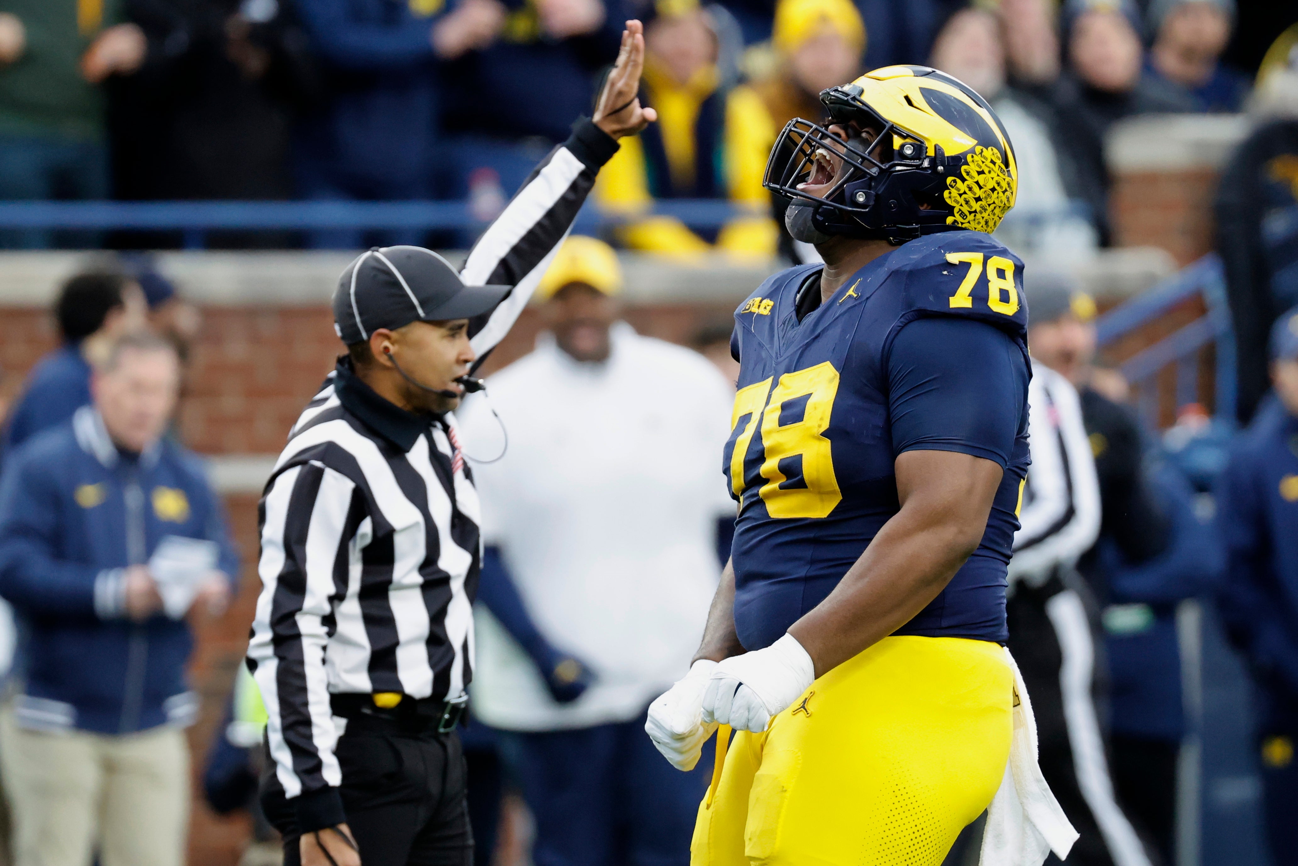 Nov 23, 2024; Ann Arbor, Michigan, USA; Michigan Wolverines defensive lineman Kenneth Grant (78) celebrates after sacking Northwestern Wildcats quarterback Jack Lausch (not pictured) in the first half at Michigan Stadium.