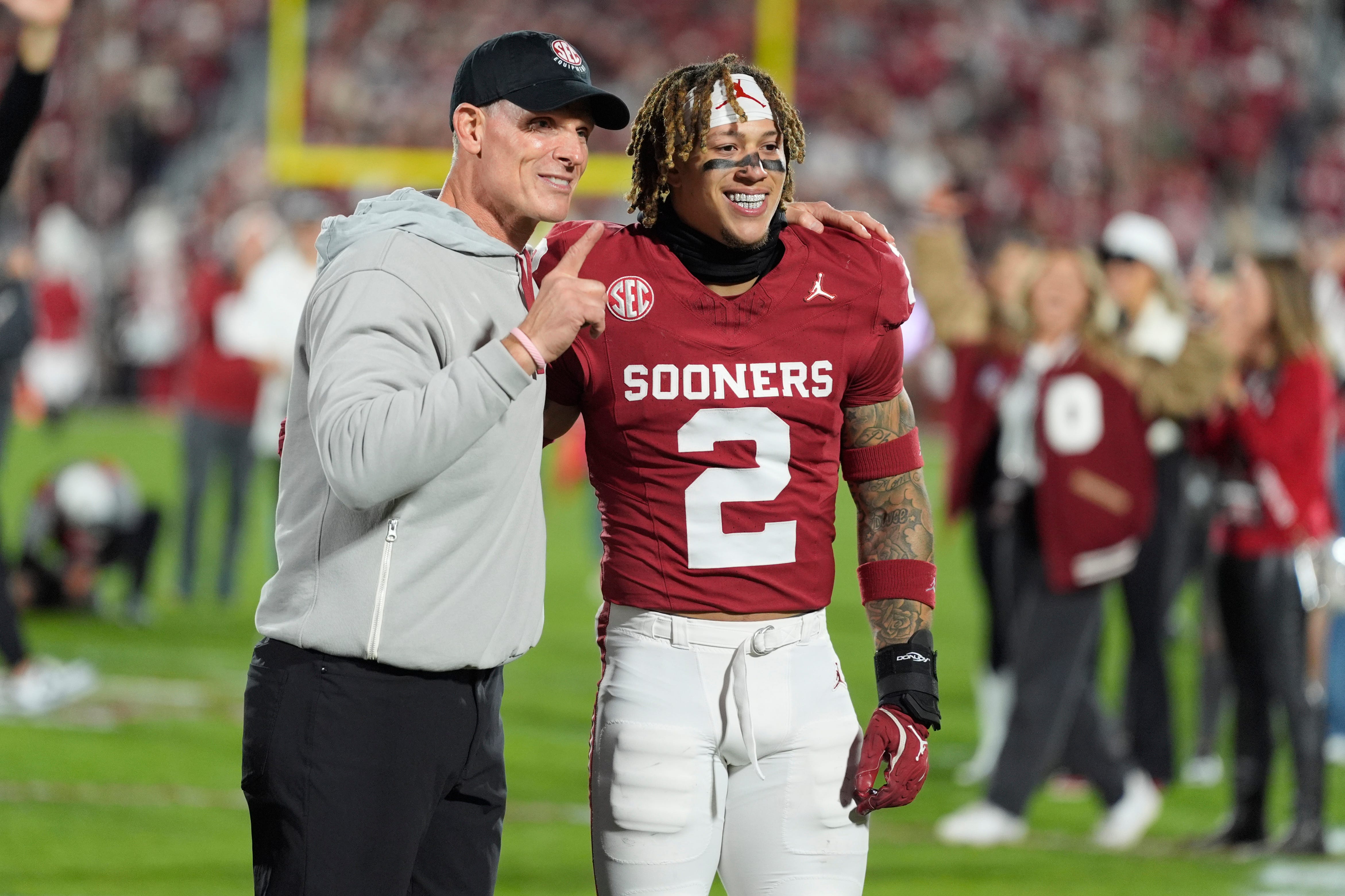 Oklahoma coach Brent Venables poses with Oklahoma Sooners defensive back Billy Bowman Jr. (2) during senior night before a college football game between the University of Oklahoma Sooners (OU) and the Alabama Crimson Tide at Gaylord Family - Oklahoma Memorial Stadium in Norman, Okla., Saturday, Nov. 23, 2024.