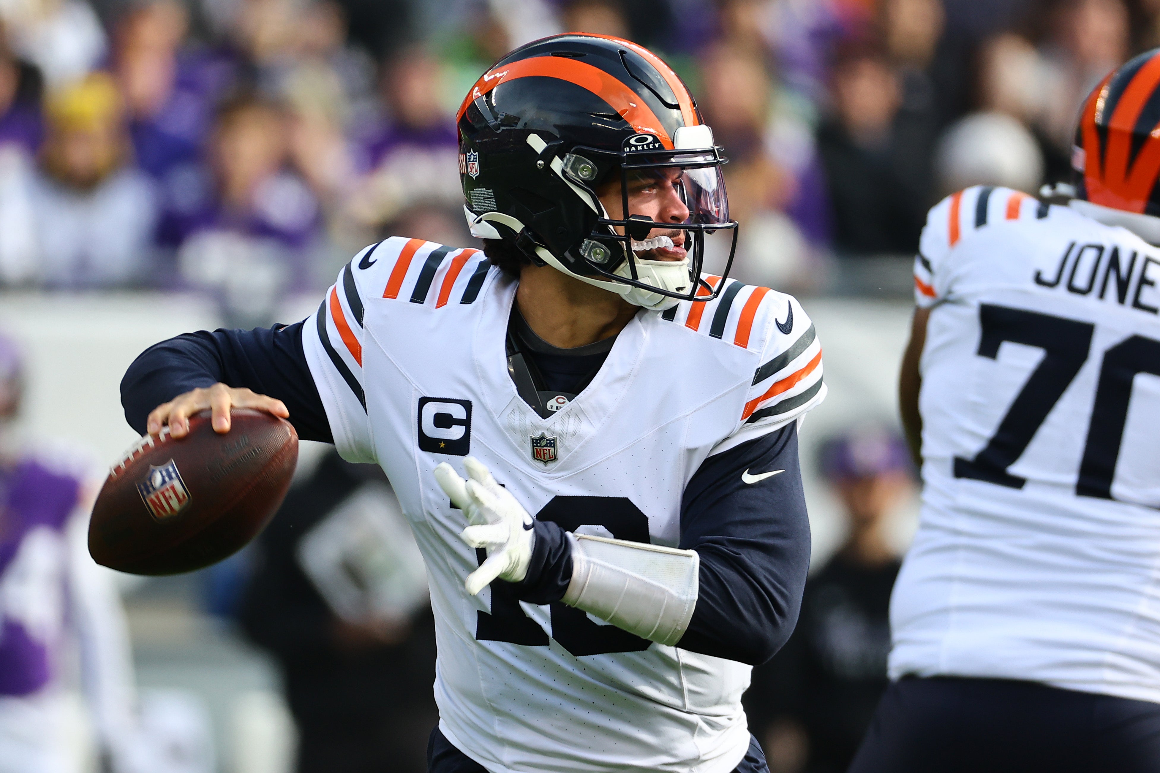 Nov 24, 2024; Chicago, Illinois, USA; Chicago Bears quarterback Caleb Williams (18) drops back to pass against the Minnesota Vikings during the first quarter at Soldier Field.