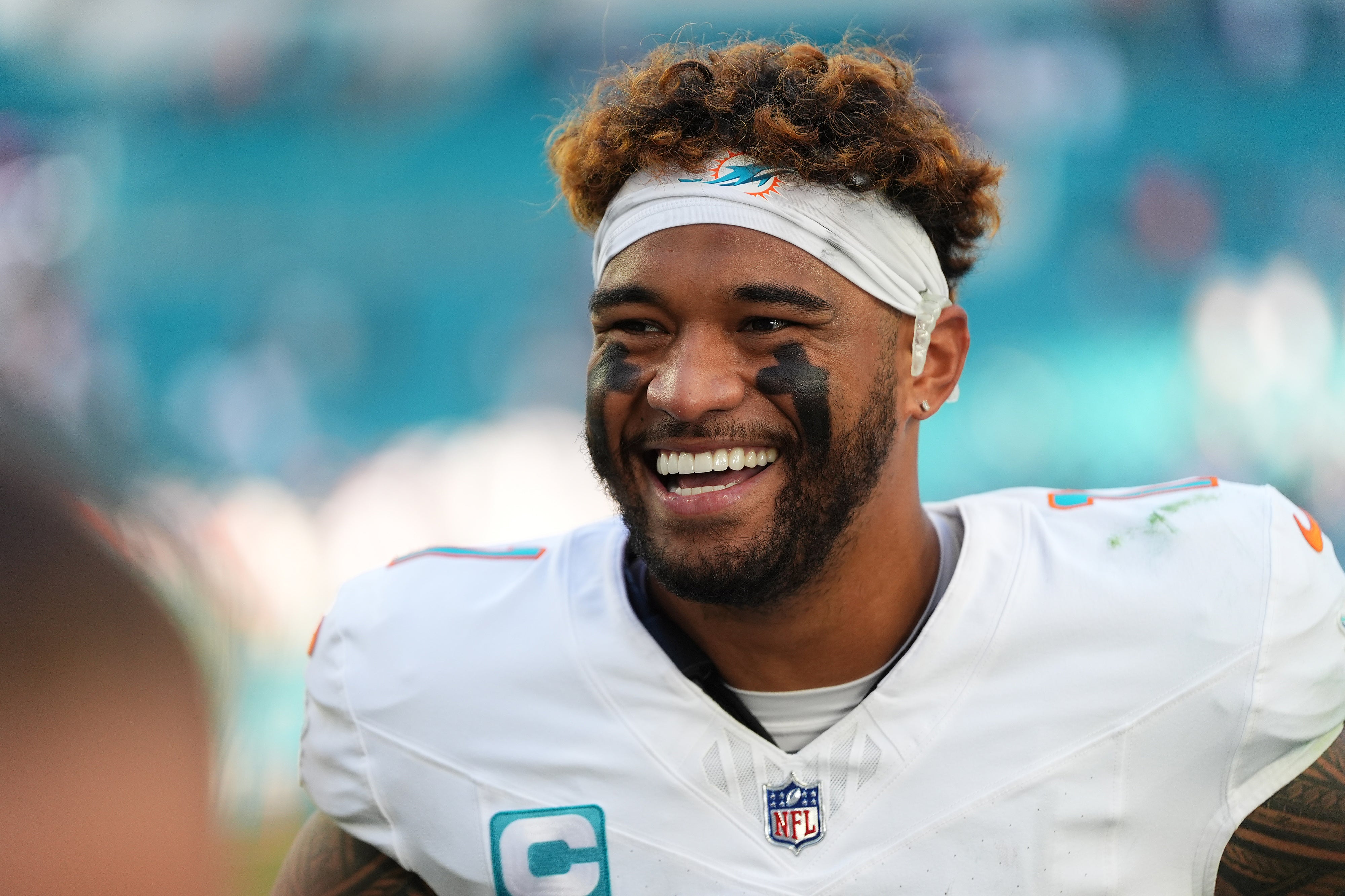 Nov 24, 2024; Miami Gardens, Florida, USA; Miami Dolphins quarterback Tua Tagovailoa (1) stands on the field after defeating the New England Patriots during the second half at Hard Rock Stadium.