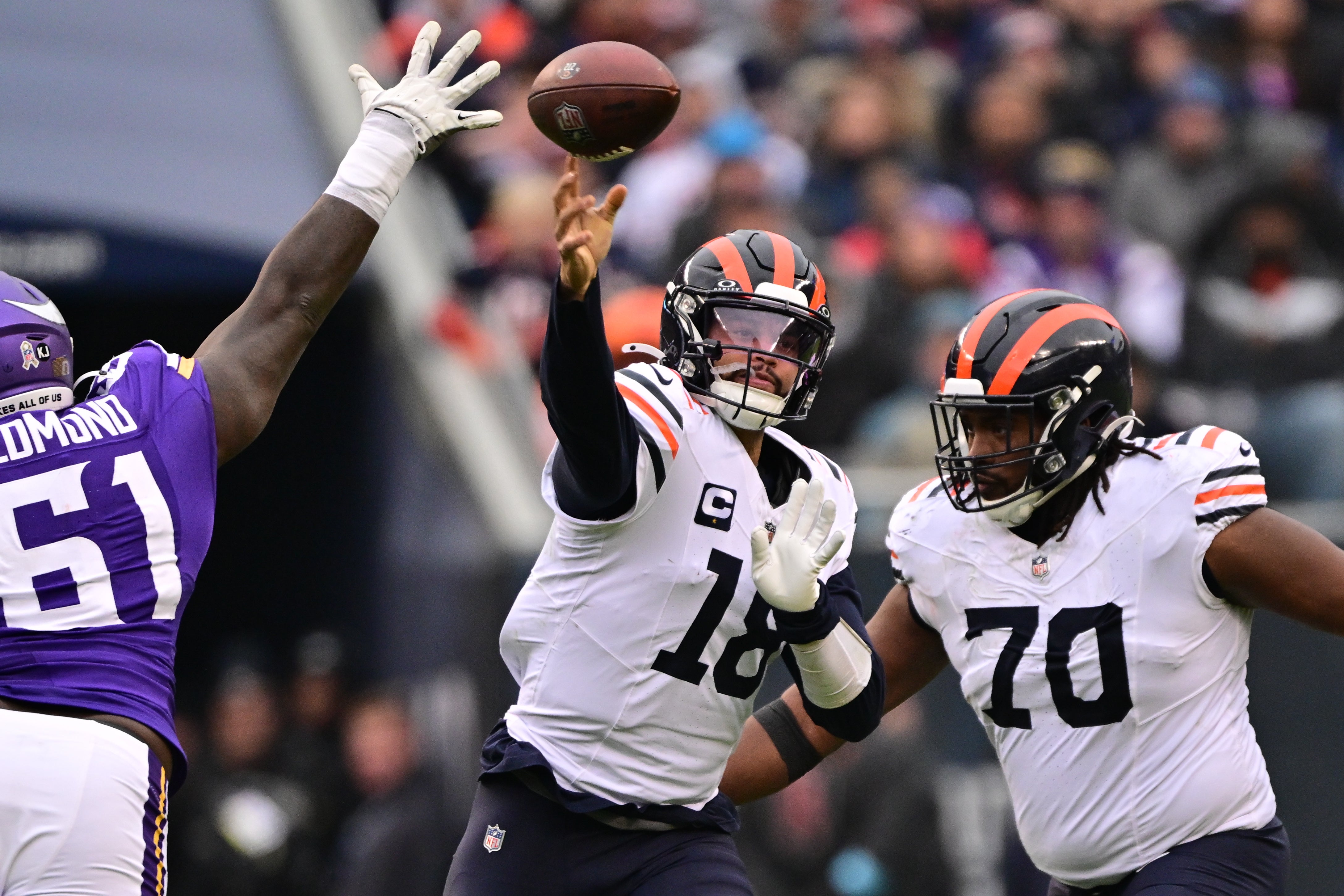 Nov 24, 2024; Chicago, Illinois, USA; Chicago Bears quarterback Caleb Williams (18) passes the ball against the Minnesota Vikings during the third quarter at Soldier Field.