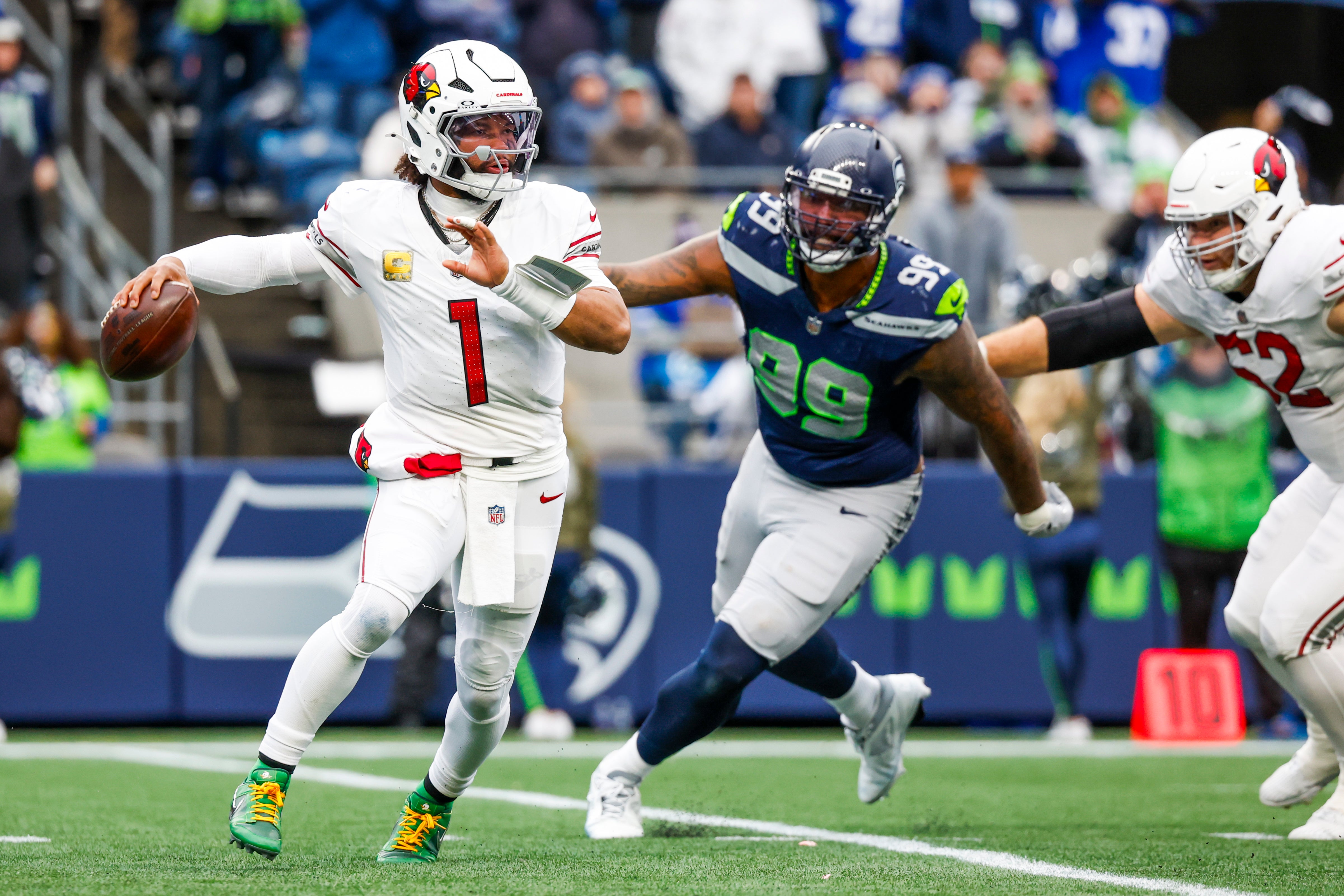 Nov 24, 2024; Seattle, Washington, USA; Arizona Cardinals quarterback Kyler Murray (1) passes against the Seattle Seahawks during the second quarter at Lumen Field.