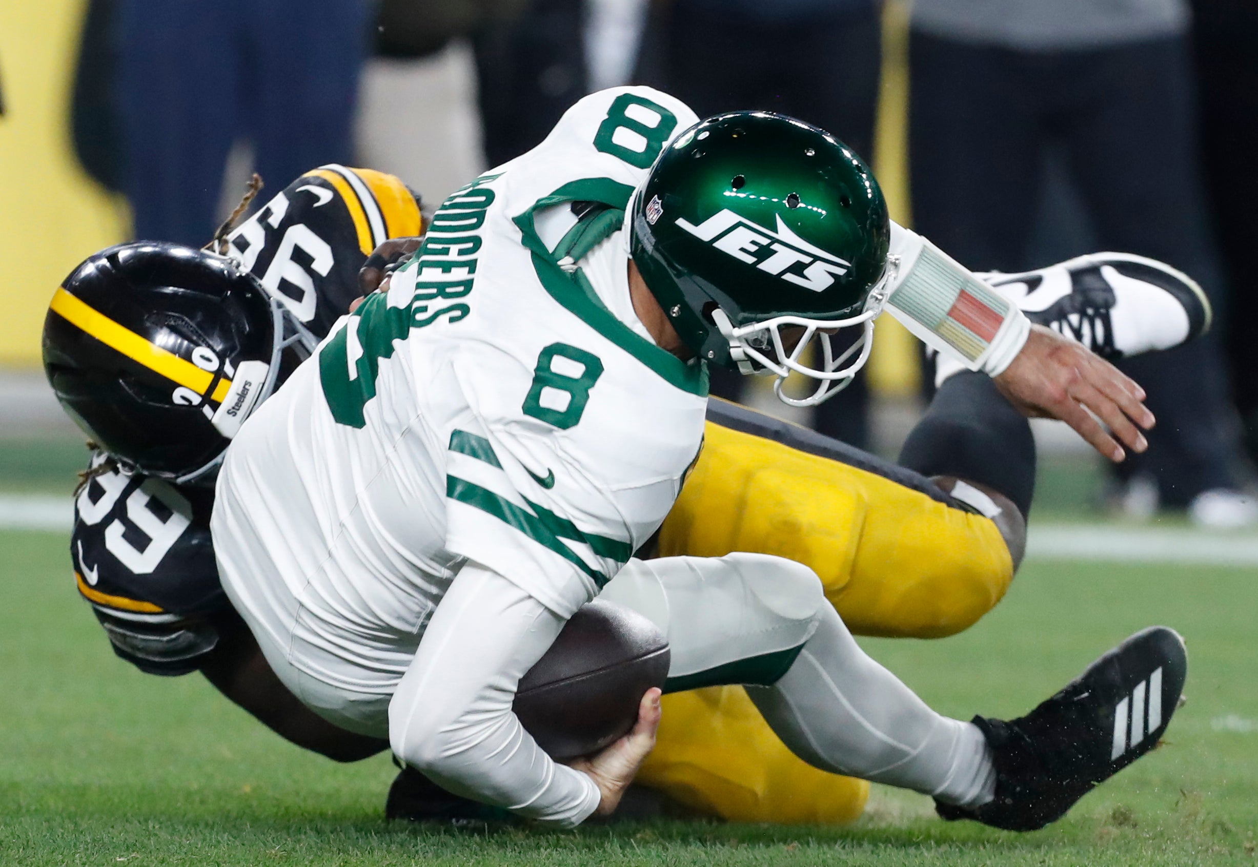 Oct 20, 2024; Pittsburgh, Pennsylvania, USA; Pittsburgh Steelers defensive tackle Larry Ogunjobi (99) sacks New York Jets quarterback Aaron Rodgers (8) during the first quarter at Acrisure Stadium.