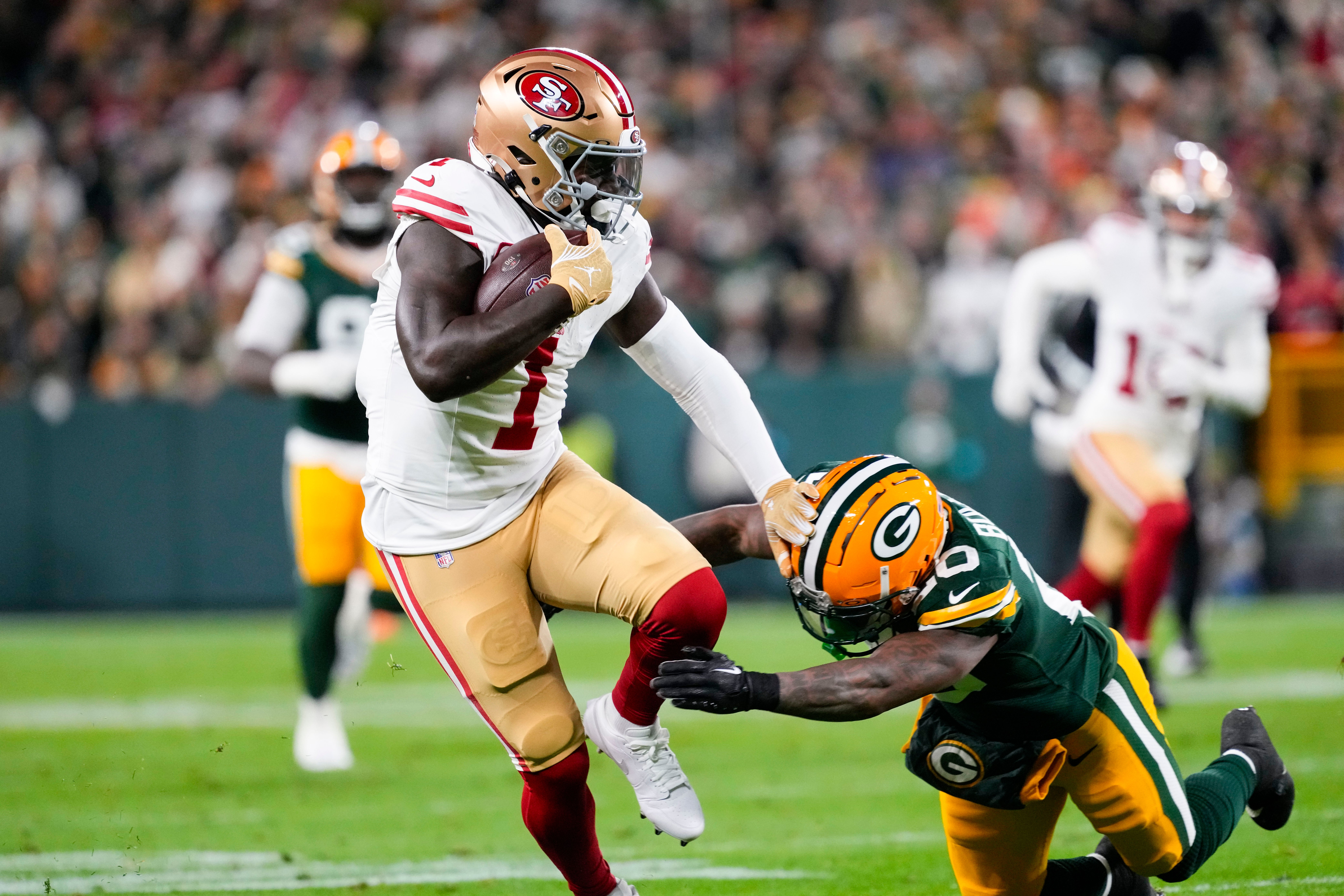 San Francisco 49ers wide receiver Deebo Samuel Sr. (1) is tackled by Green Bay Packers safety Javon Bullard (20) during the second quarter at Lambeau Field.