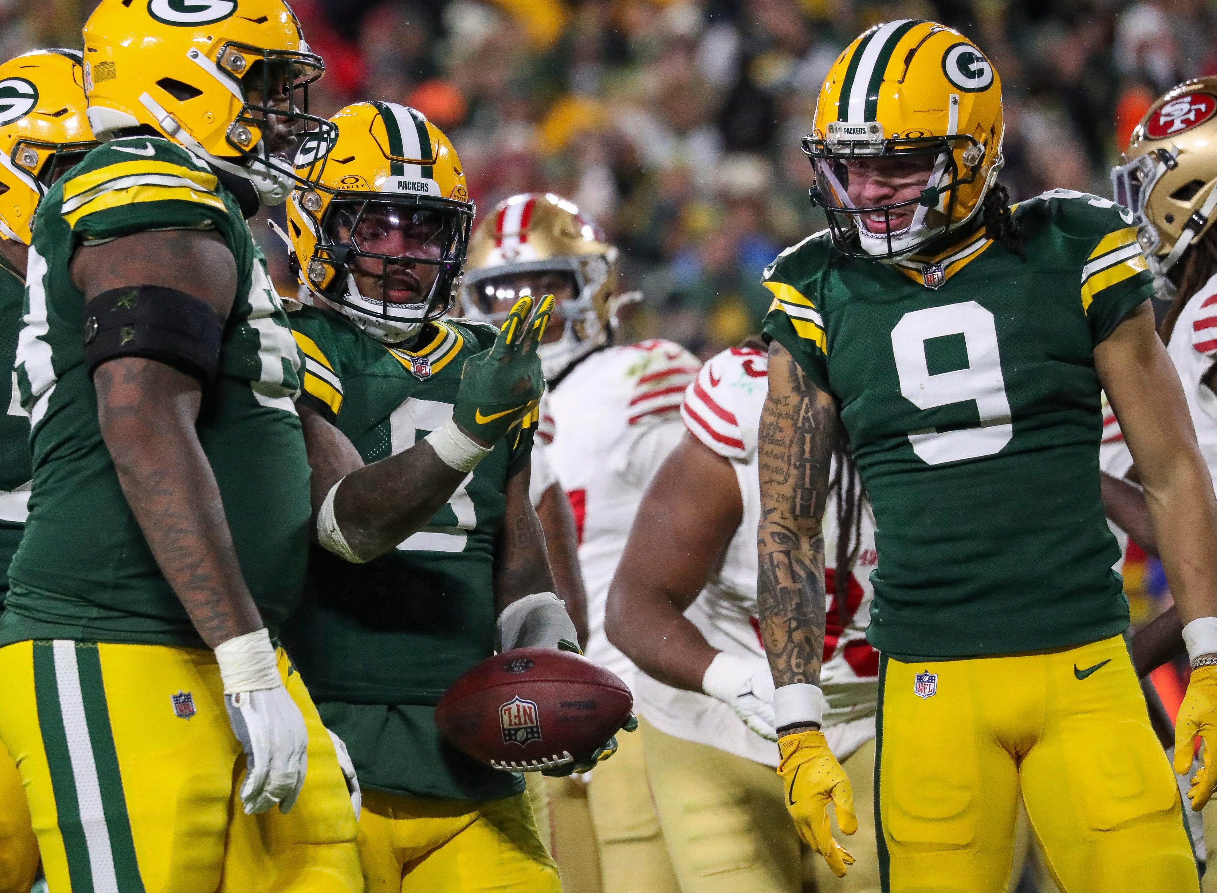 Green Bay Packers running back Josh Jacobs (8) counts off after scoring his third rushing touchdown against the San Francisco 49ers on Sunday, November 24, 2024, at Lambeau Field in Green Bay, Wis. The Packers won the game, 38-10.