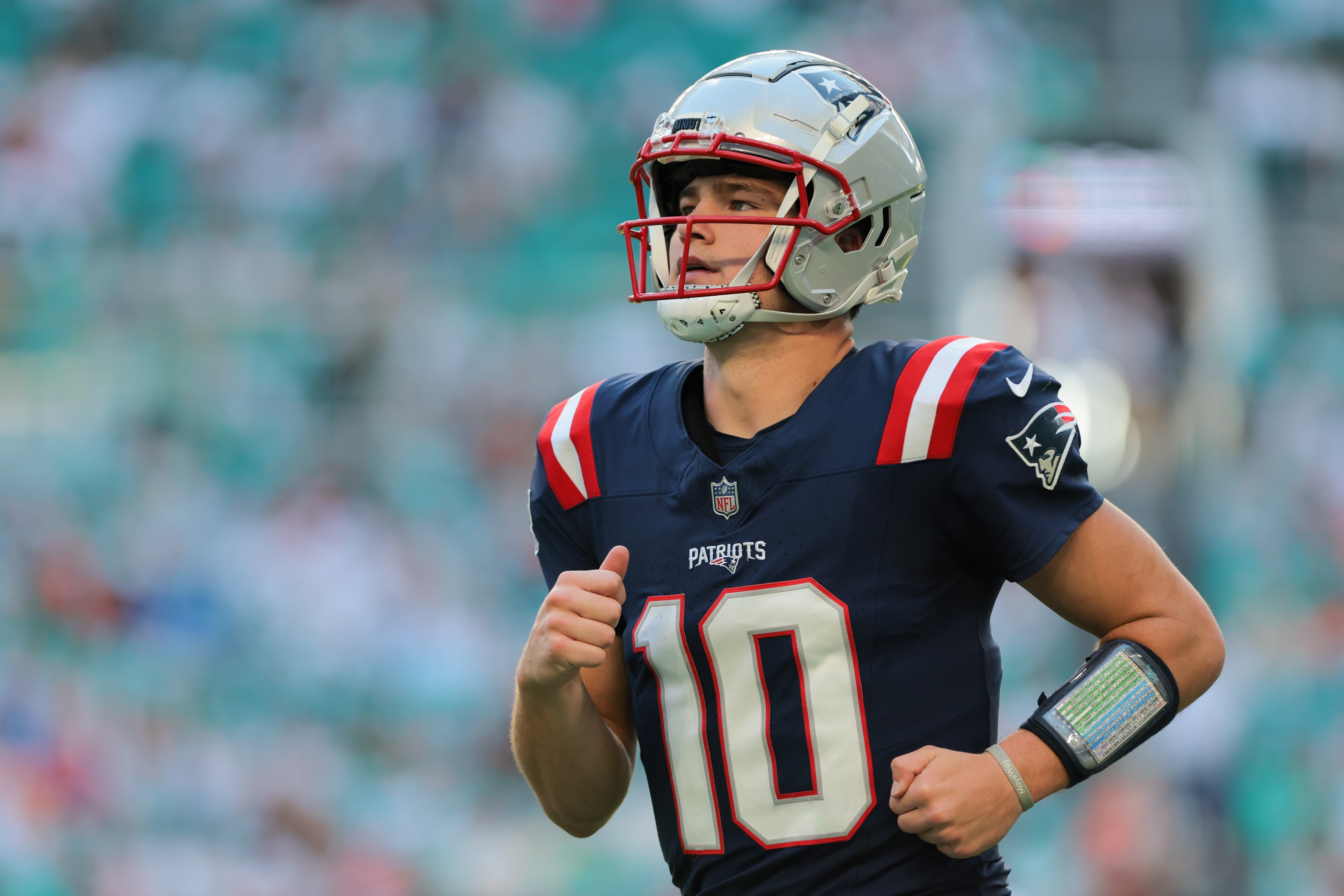 Nov 24, 2024; Miami Gardens, Florida, USA; New England Patriots quarterback Drake Maye (10) looks on against the Miami Dolphins during the fourth quarter at Hard Rock Stadium.