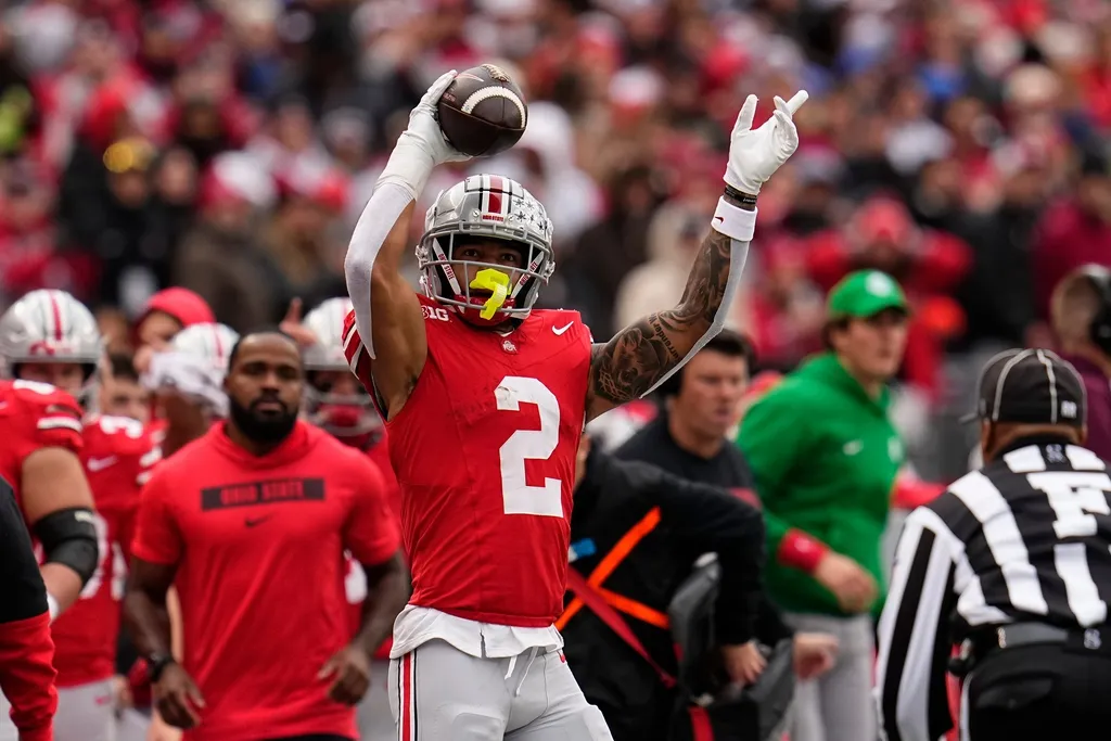 Ohio State Buckeyes wide receiver Emeka Egbuka (2) celebrates a first down catch during the second half of the NCAA football game against the Indiana Hoosiers at Ohio Stadium in Columbus on Saturday