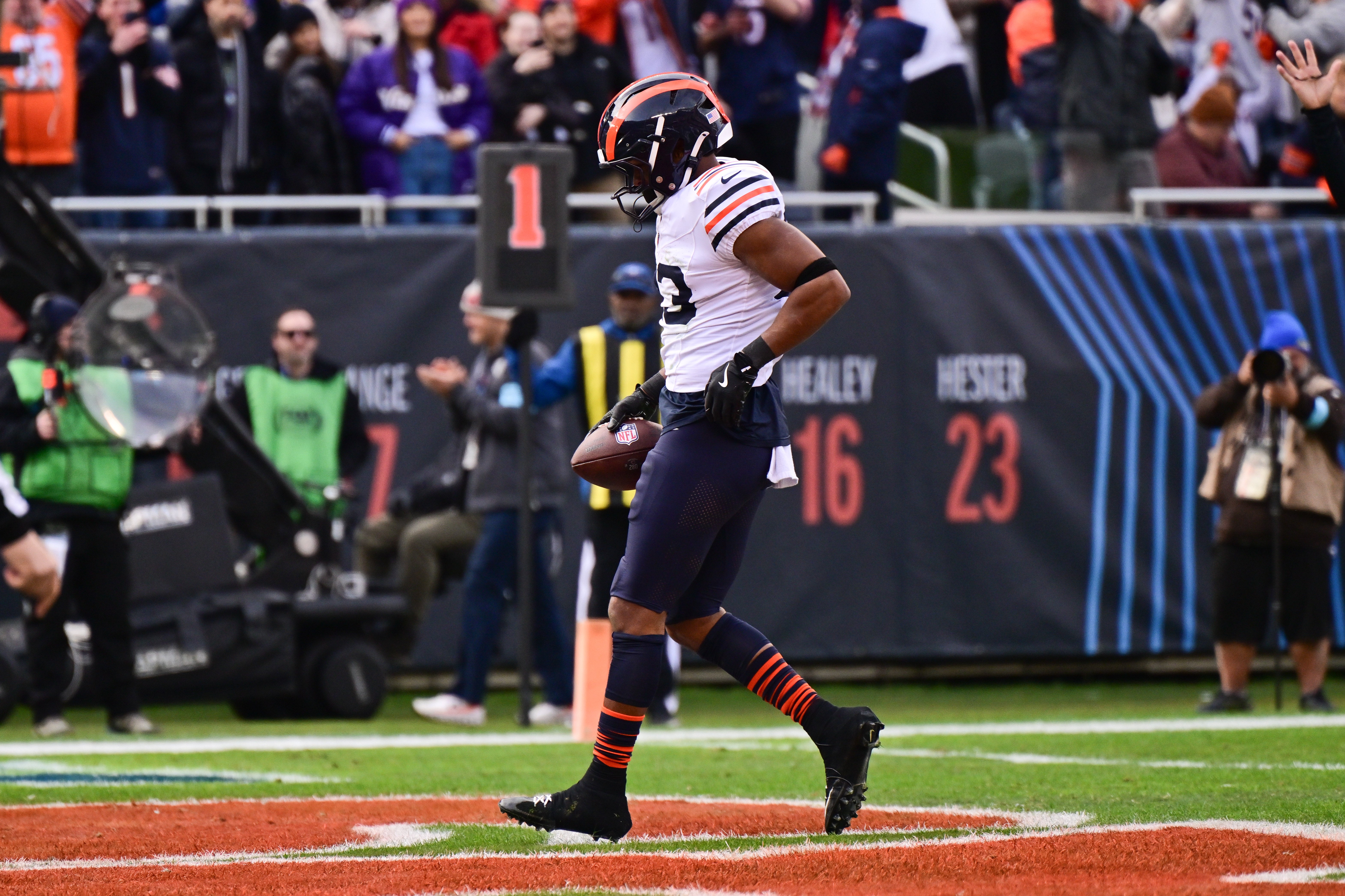 Nov 24, 2024; Chicago, Illinois, USA; Chicago Bears running back Roschon Johnson (23) rushes for a touchdown against the Minnesota Vikings during the first quarter at Soldier Field.