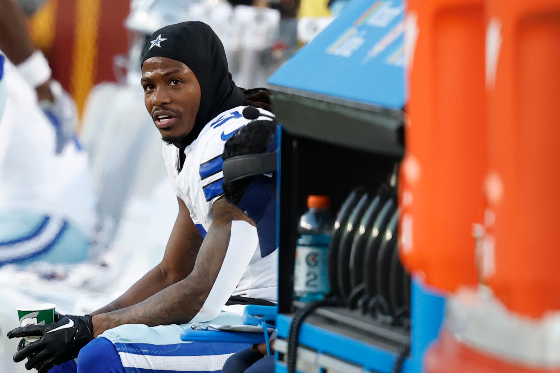 Dallas Cowboys wide receiver KaVontae Turpin (9) sits on the bench after returning a kickoff for a touchdown against the Washington Commanders during the fourth quarter at Northwest Stadium.