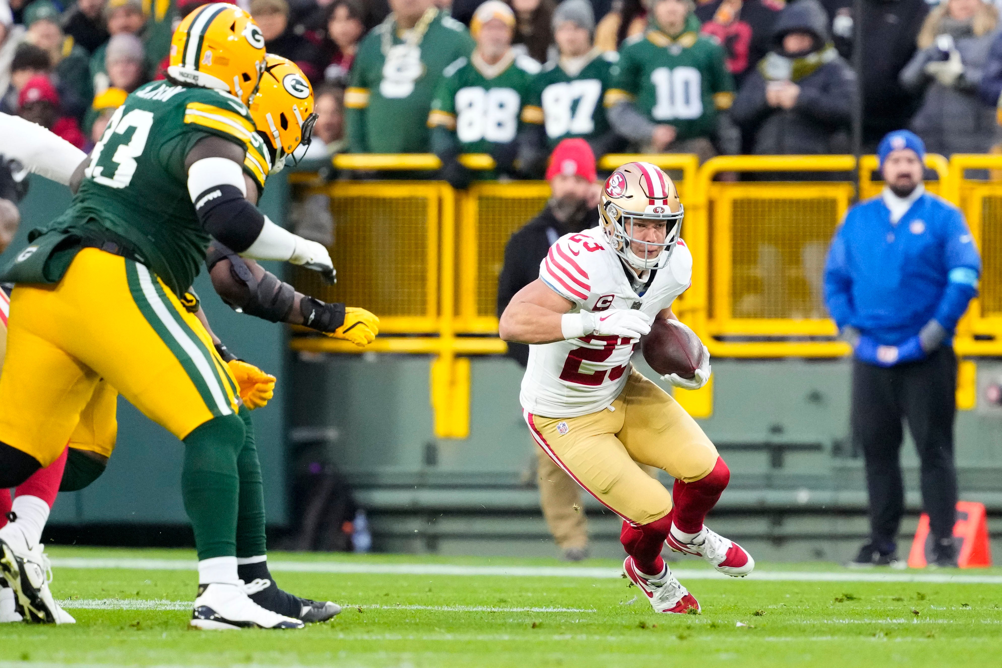San Francisco 49ers running back Christian McCaffrey (23) rushes with the football during the first quarter against the Green Bay Packers at Lambeau Field.