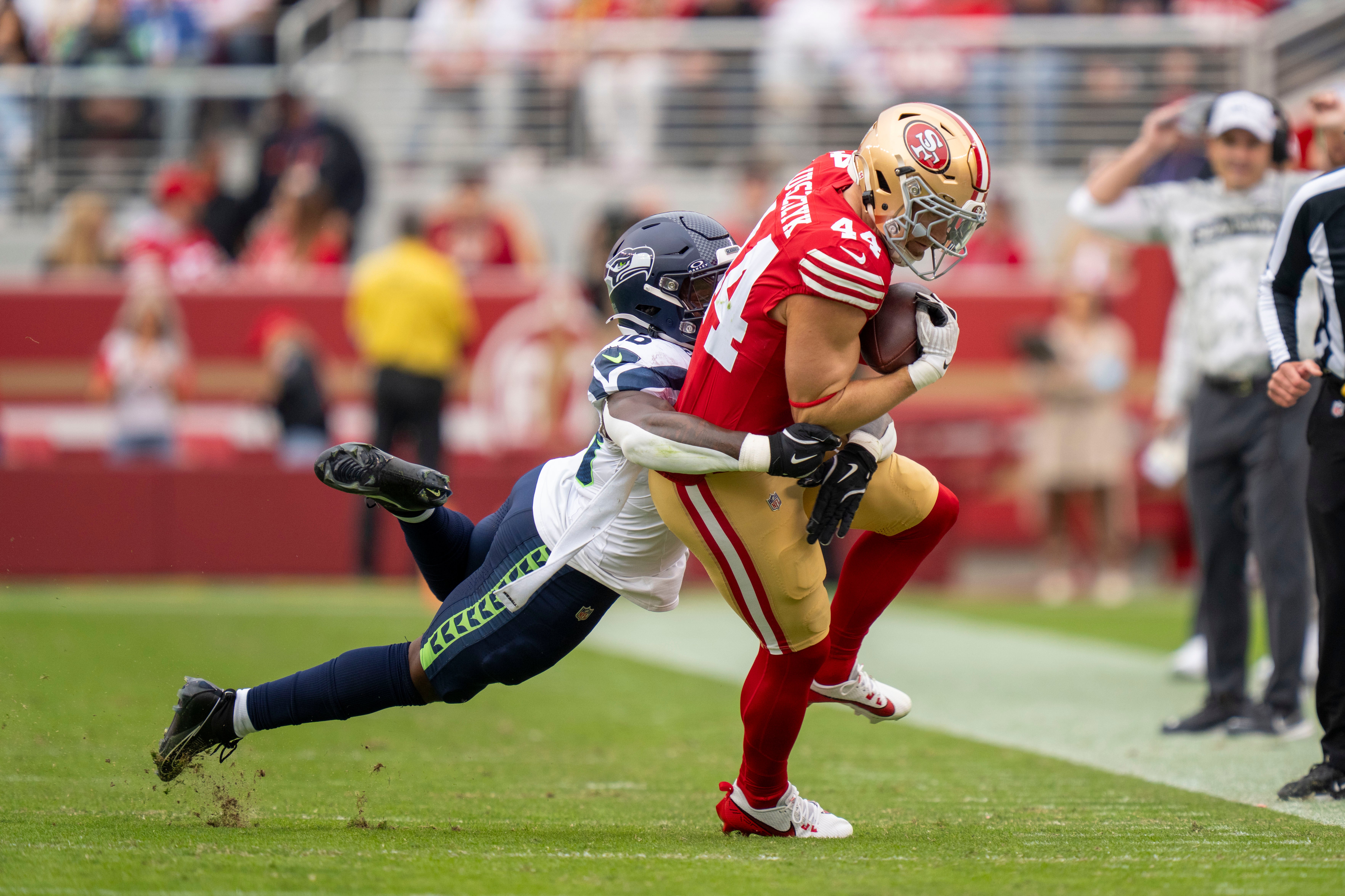 San Francisco 49ers fullback Kyle Juszczyk (44) is tackled by Seattle Seahawks linebacker Tyrice Knight (48) during the second quarter at Levi's Stadium.