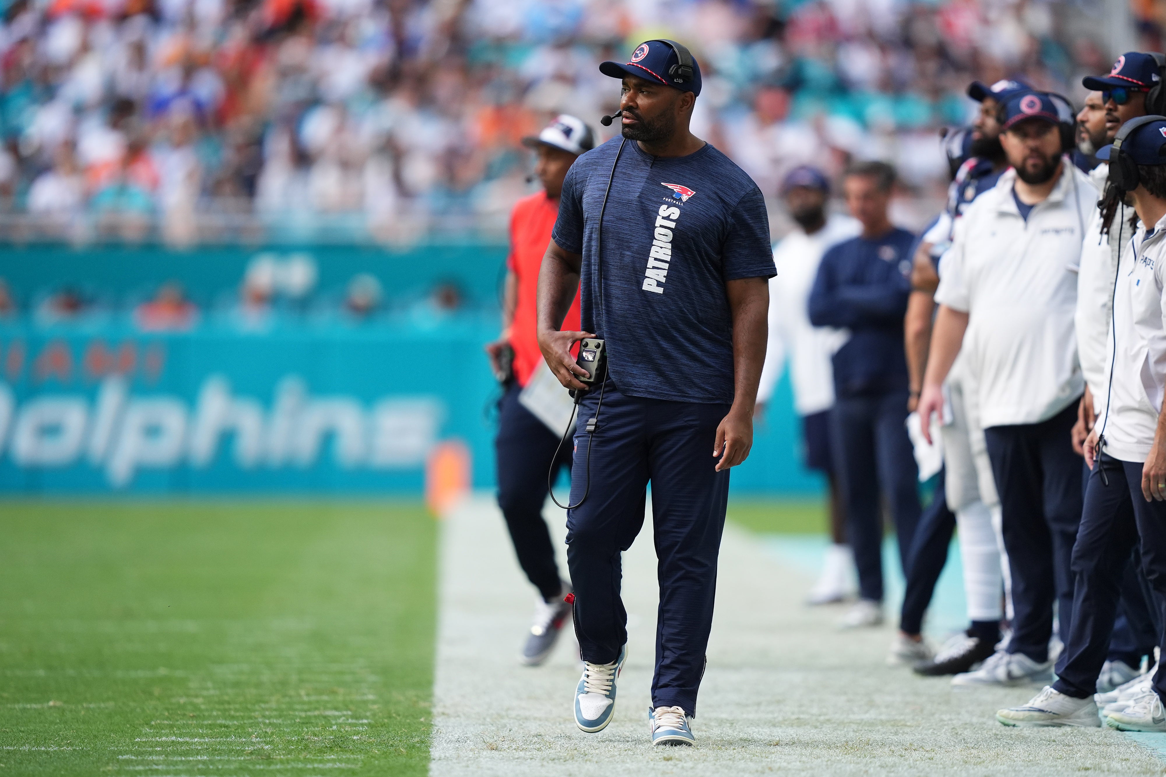 Nov 24, 2024; Miami Gardens, Florida, USA; New England Patriots head coach Jerod Mayo walks down the sideline during the first half against the Miami Dolphins at Hard Rock Stadium.