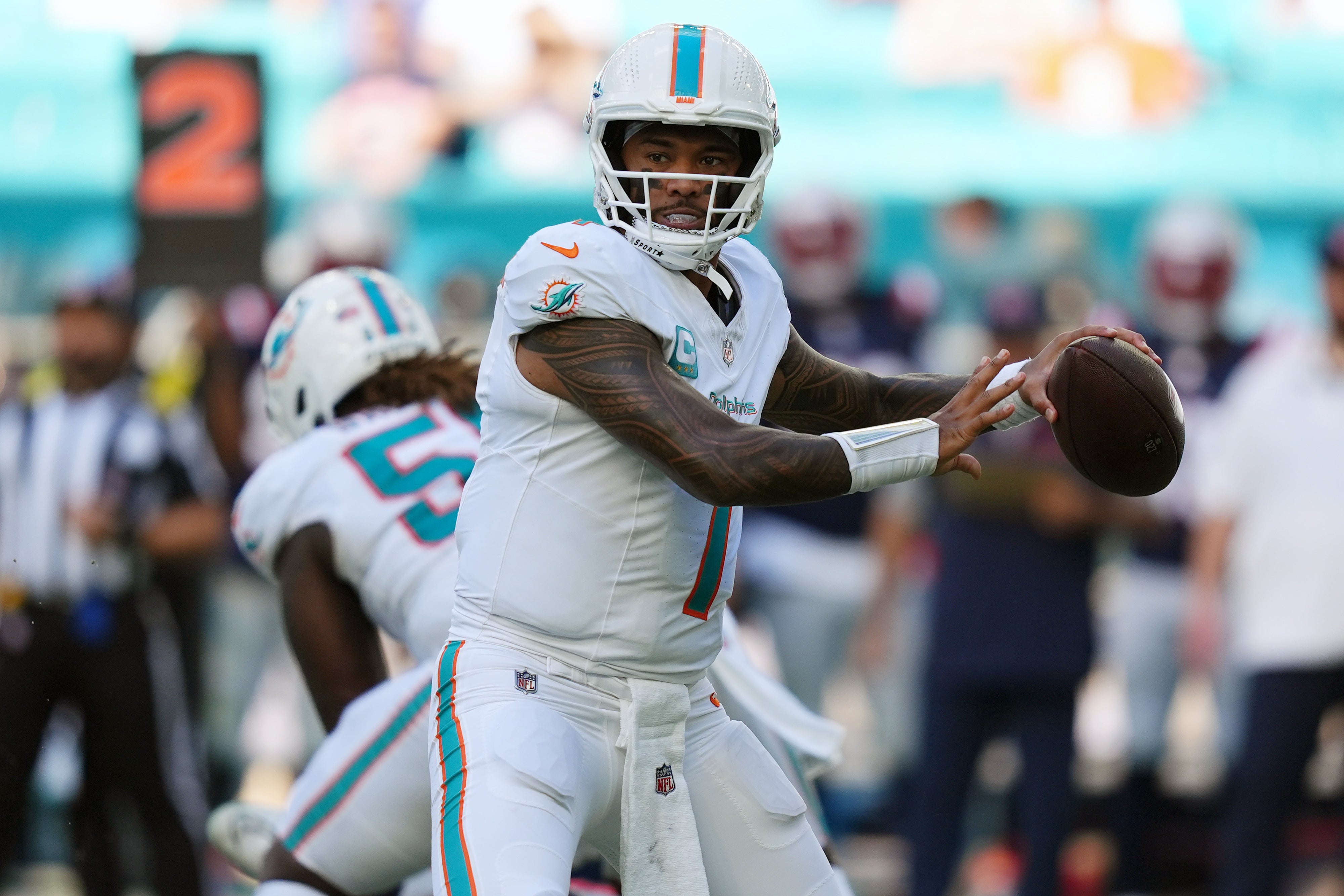 Miami Dolphins quarterback Tua Tagovailoa (1) attempts a pass against the New England Patriots during the second half at Hard Rock Stadium.