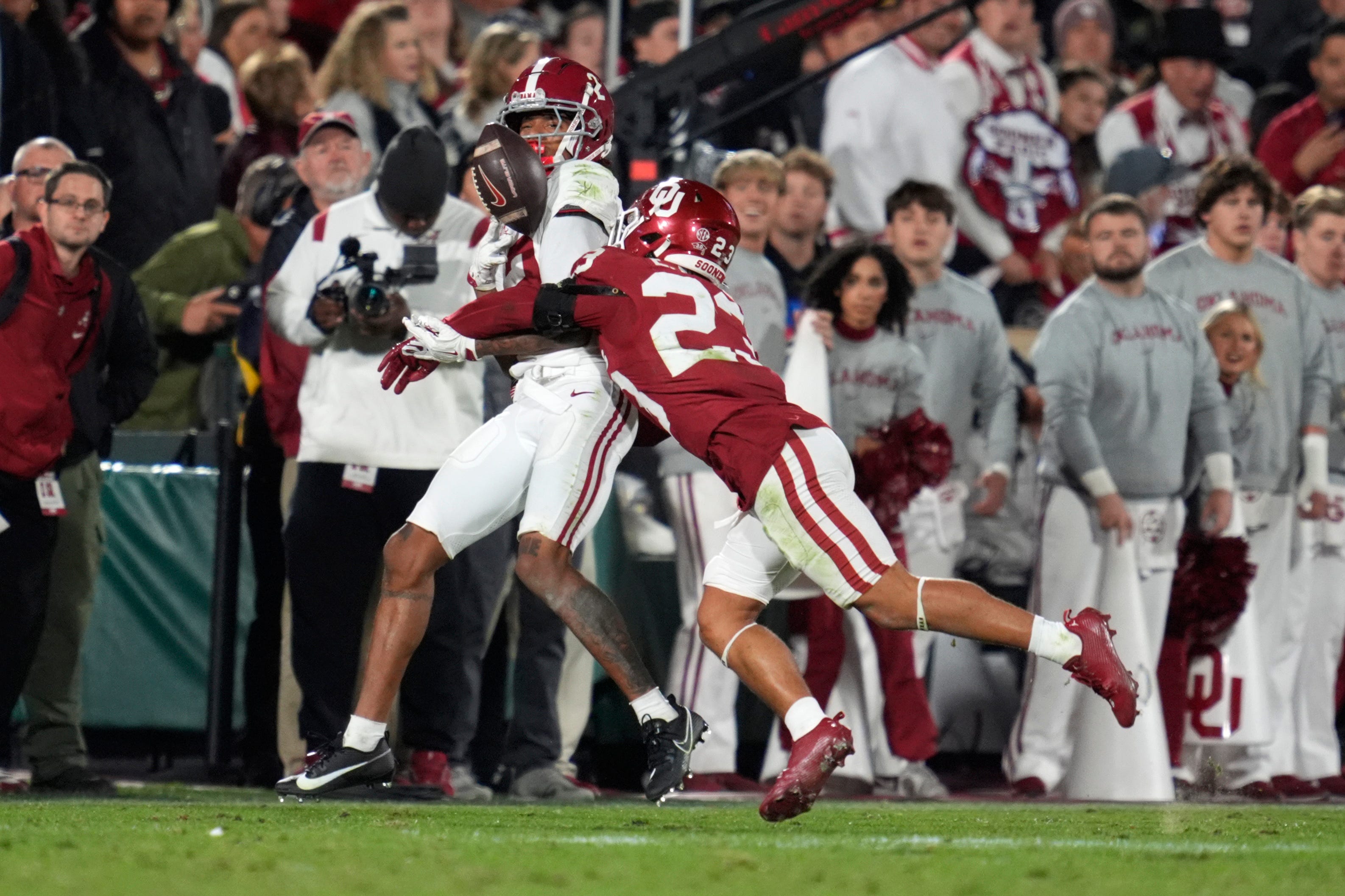 Oklahoma Sooners defensive back Eli Bowen (23) knocks the ball away from Alabama Crimson Tide wide receiver Emmanuel Henderson Jr. (3) during a college football game between the University of Oklahoma Sooners (OU) and the Alabama Crimson Tide at Gaylord Family - Oklahoma Memorial Stadium in Norman, Okla., Saturday, Nov. 23, 2024. Oklahoma won 24-3.