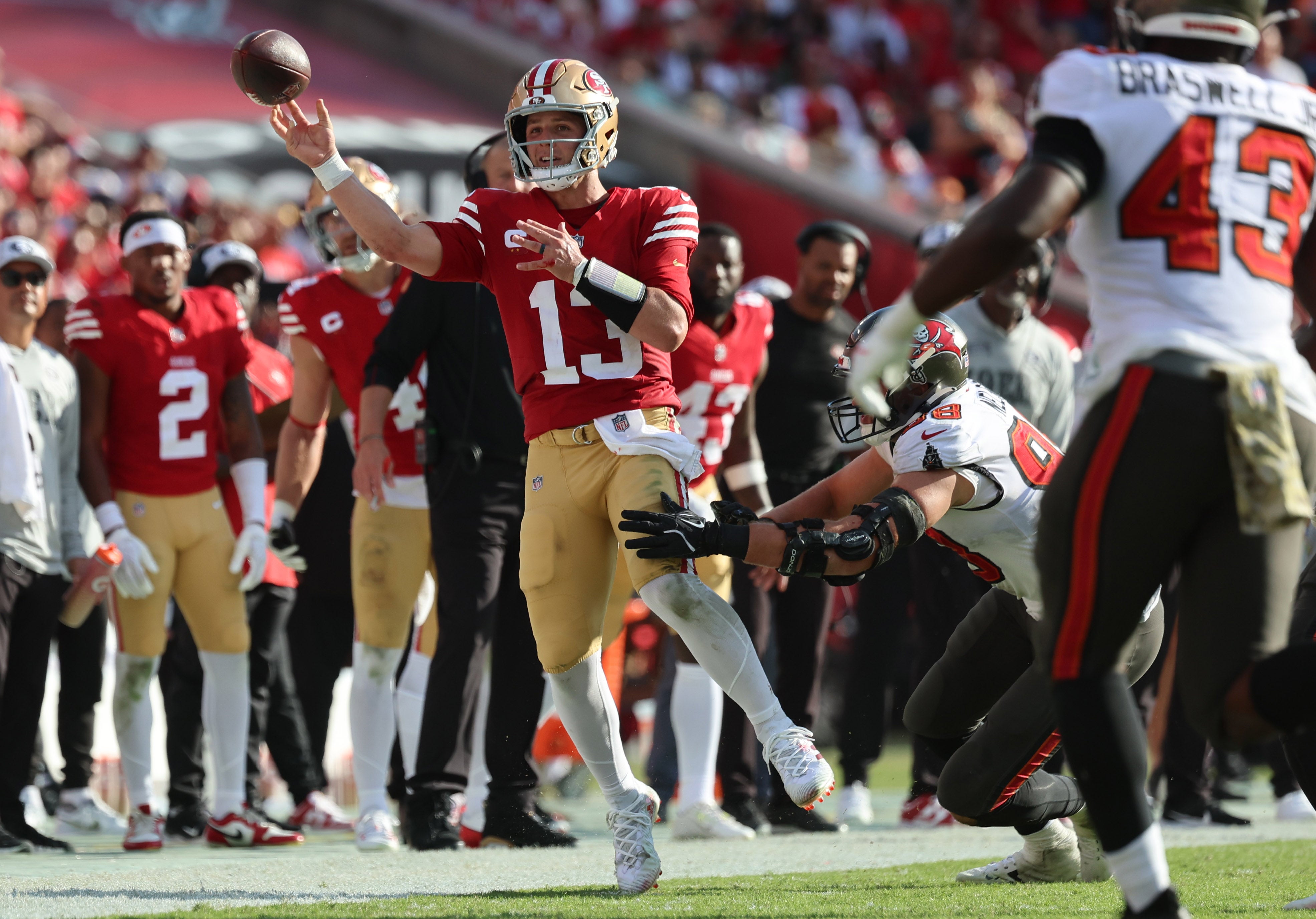 San Francisco 49ers quarterback Brock Purdy (13) throws the ball as Tampa Bay Buccaneers linebacker Anthony Nelson (98) defends during the second half at Raymond James Stadium.