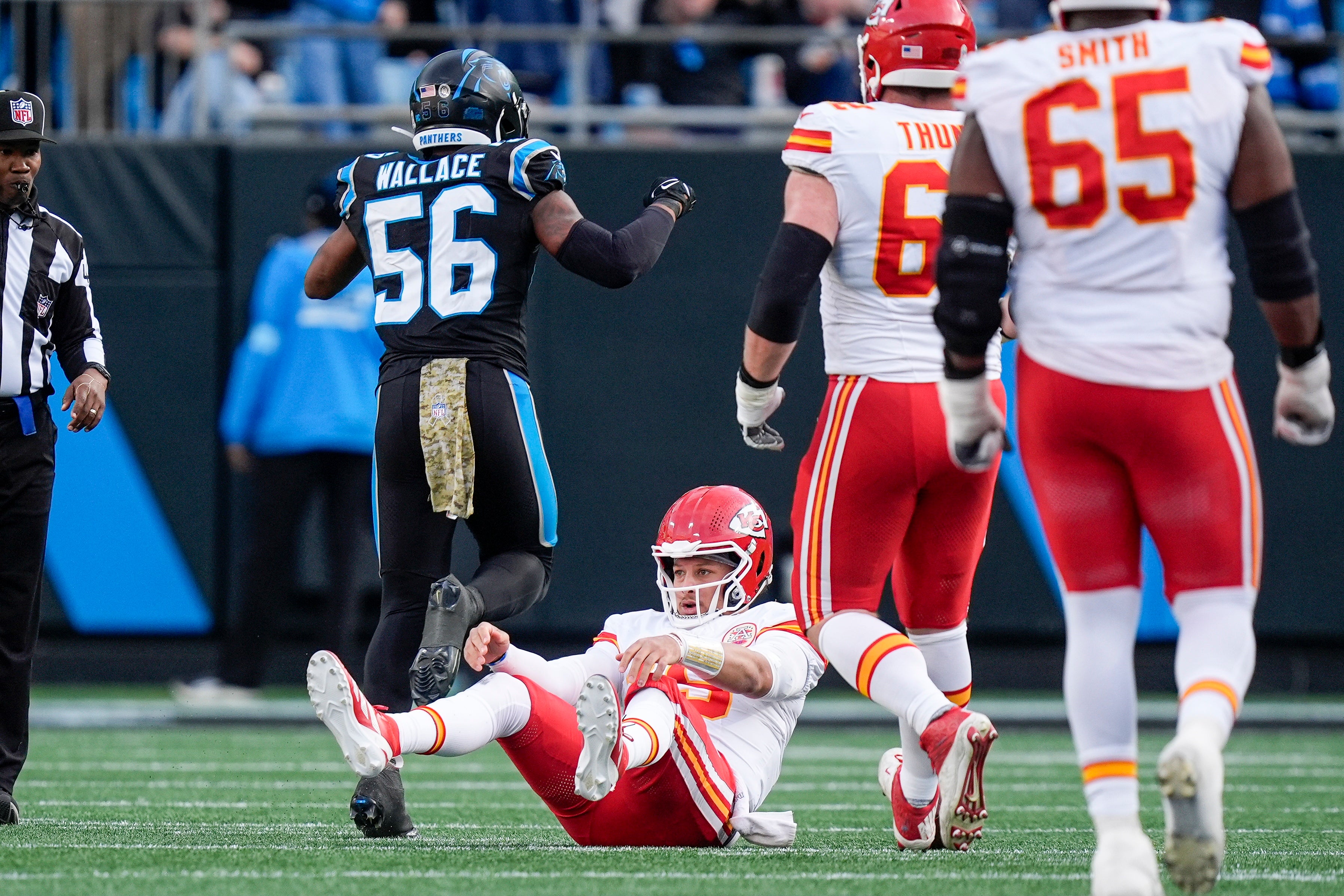Chiefs quarterback Patrick Mahomes (15) is sacked against the Carolina Panthers.