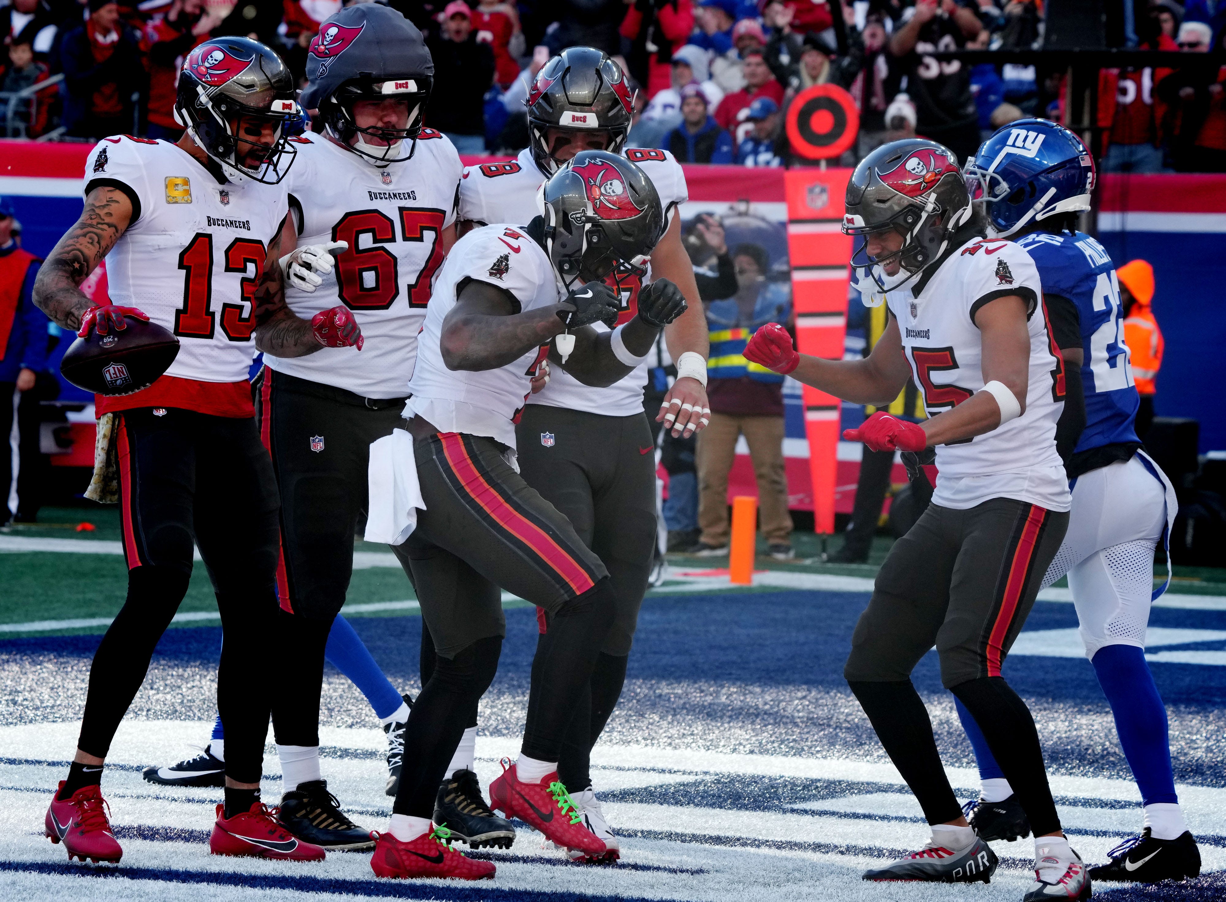East Rutherford, NJ -- November 24, 2024 -- Tampa celebrates a TD by Bucky Irving in the first half as the Tampa Bay Buccaneers came to MetLife Stadium to play the New York Giants.