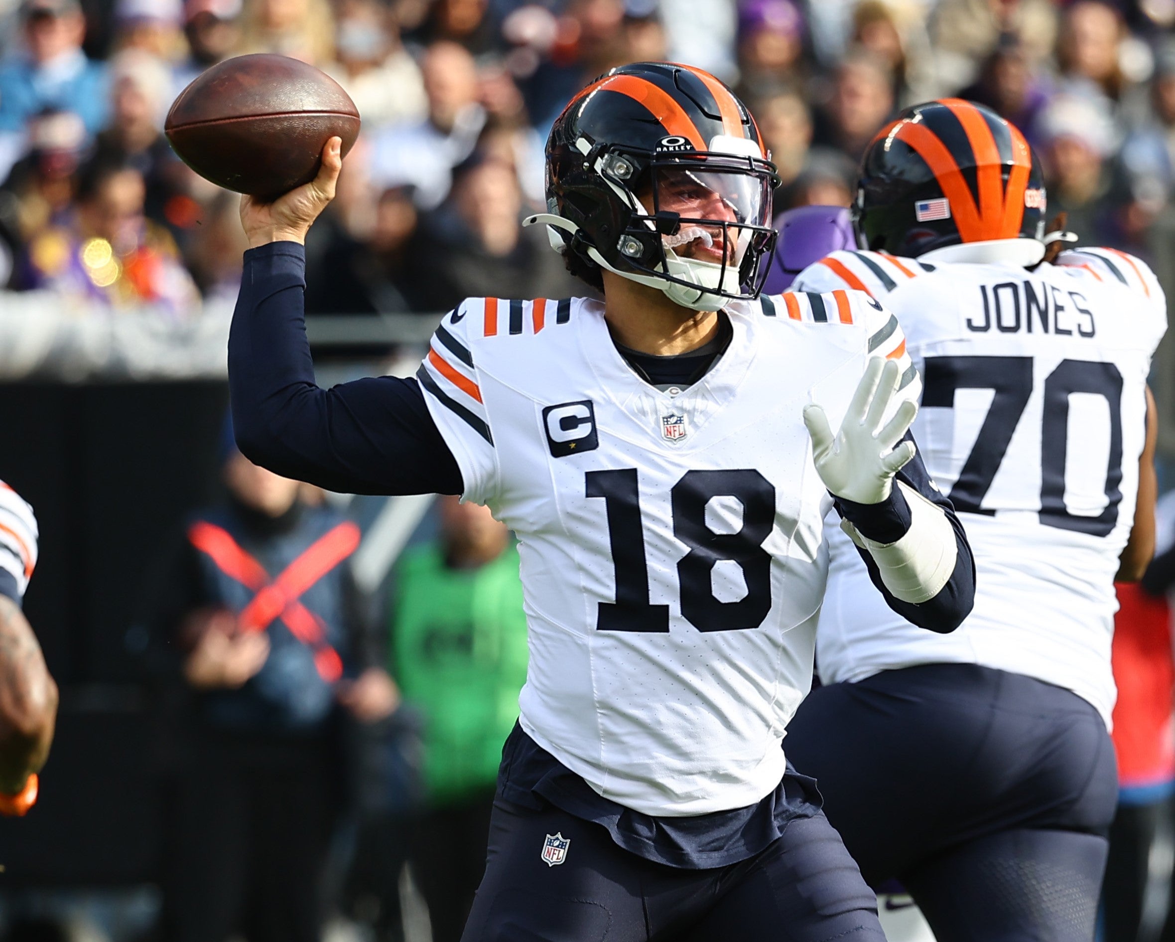 Nov 24, 2024; Chicago, Illinois, USA; Chicago Bears quarterback Caleb Williams (18) drops back to pass against the Minnesota Vikings during the first quarter at Soldier Field.