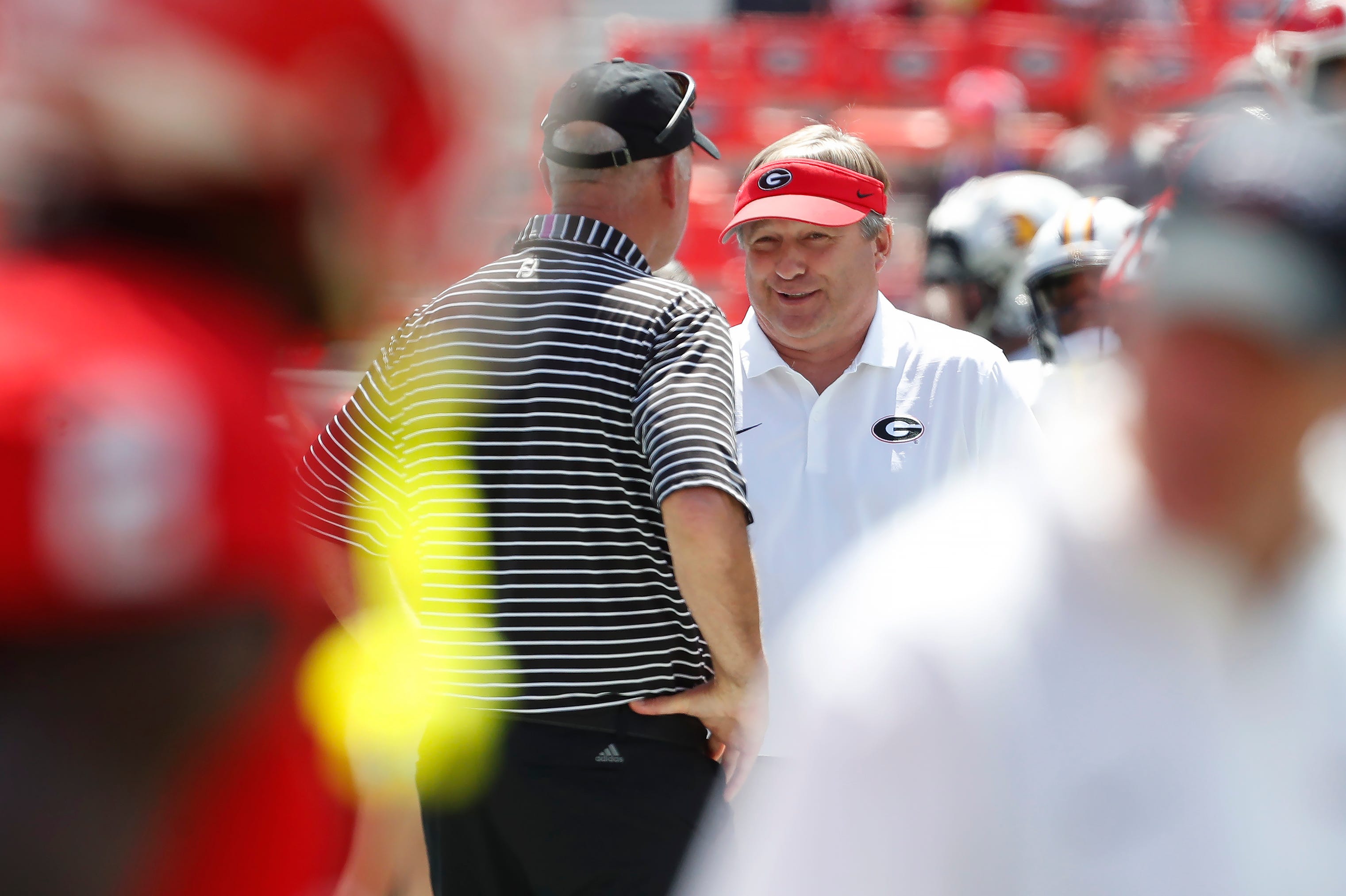 Georgia coach Kirby Smart speaks with Tennessee Tech coach Bobby Wilder before the start of a NCAA college football game in Athens, on Saturday, Sept. 7, 2024