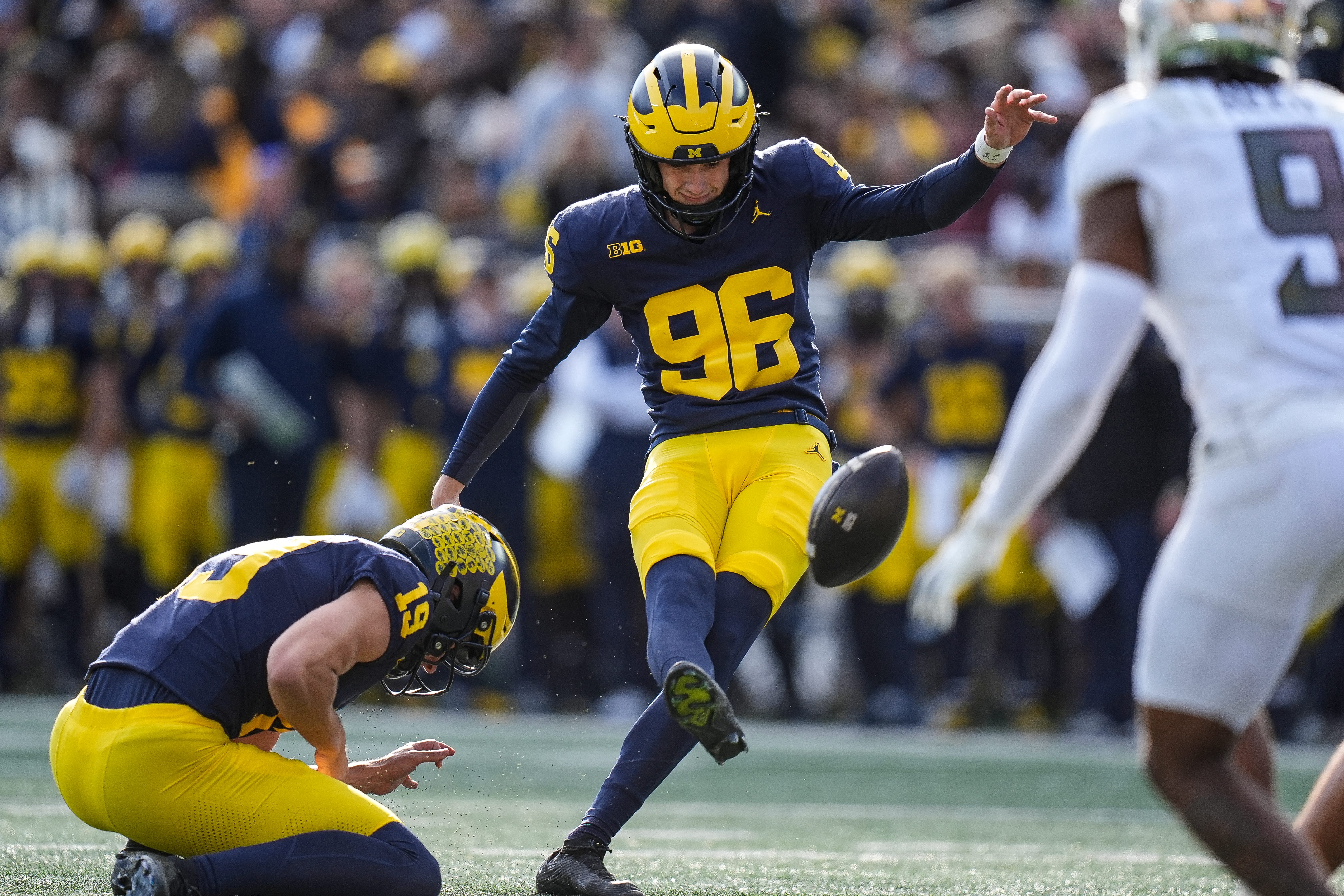 Michigan place kicker Dominic Zvada (96) attempts an extra point against Oregon during the first half at Michigan Stadium in Ann Arbor on Saturday, Nov. 2, 2024.