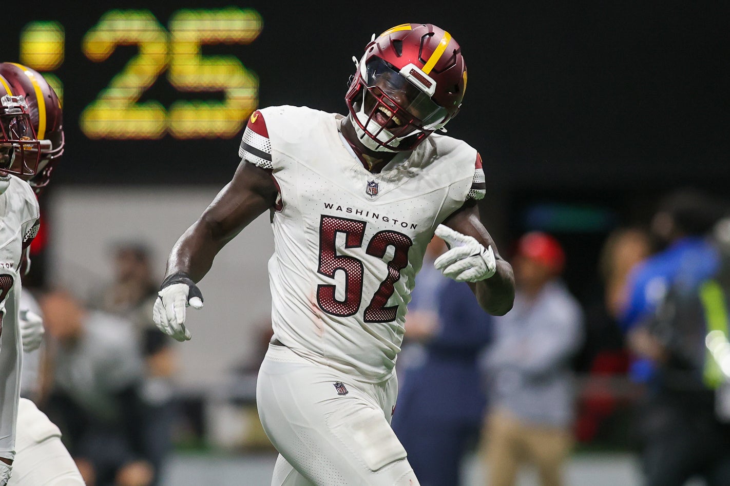 Oct 15, 2023; Atlanta, Georgia, USA; Washington Commanders linebacker Jamin Davis (52) reacts after an interception against the Atlanta Falcons in the second half at Mercedes-Benz Stadium.