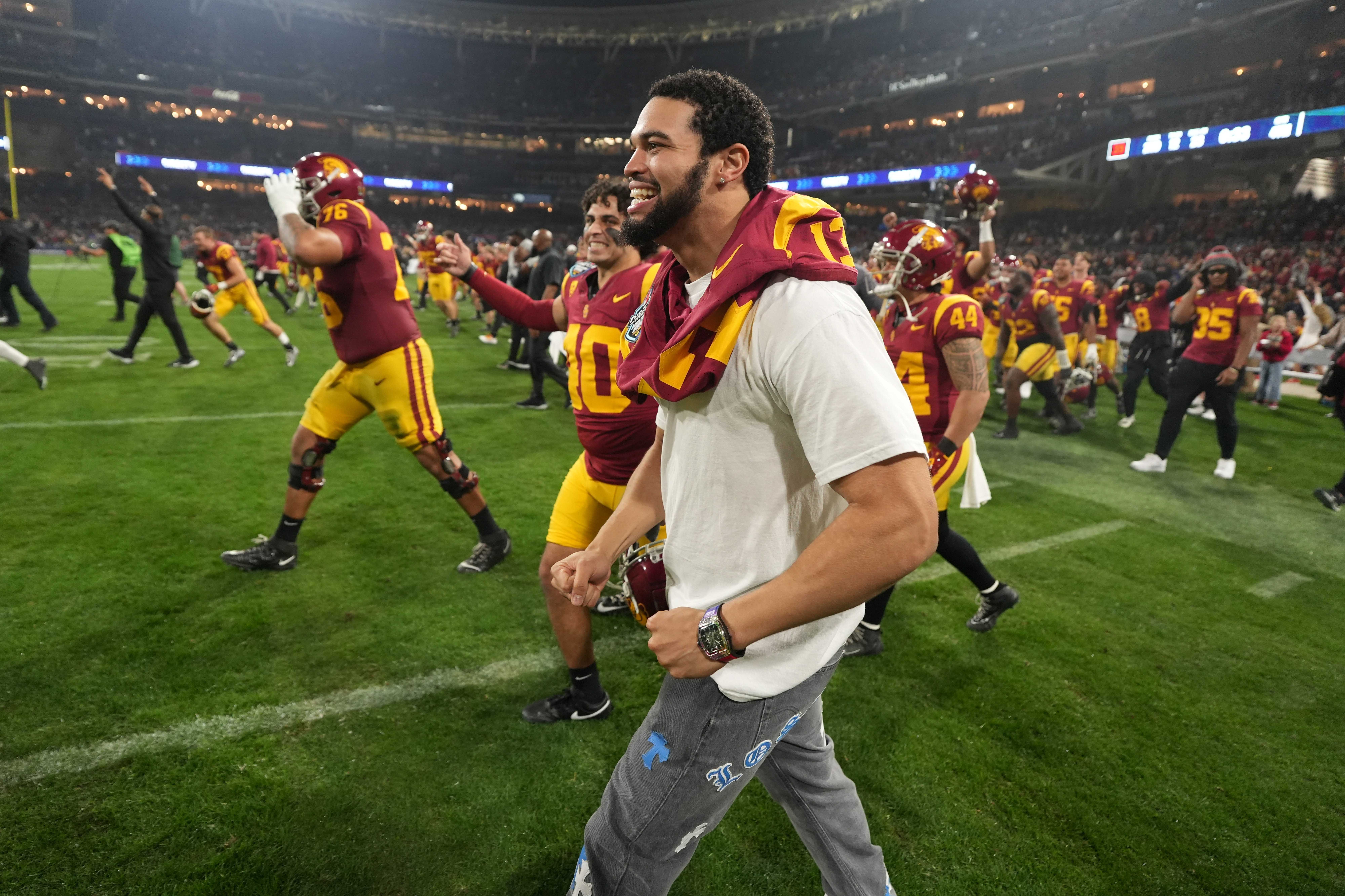 Dec 27, 2023; San Diego, CA, USA; Southern California Trojans quarterback Caleb Williams (13) celebrates after the Holiday Bowl against the Louisville Cardinals at Petco Park.