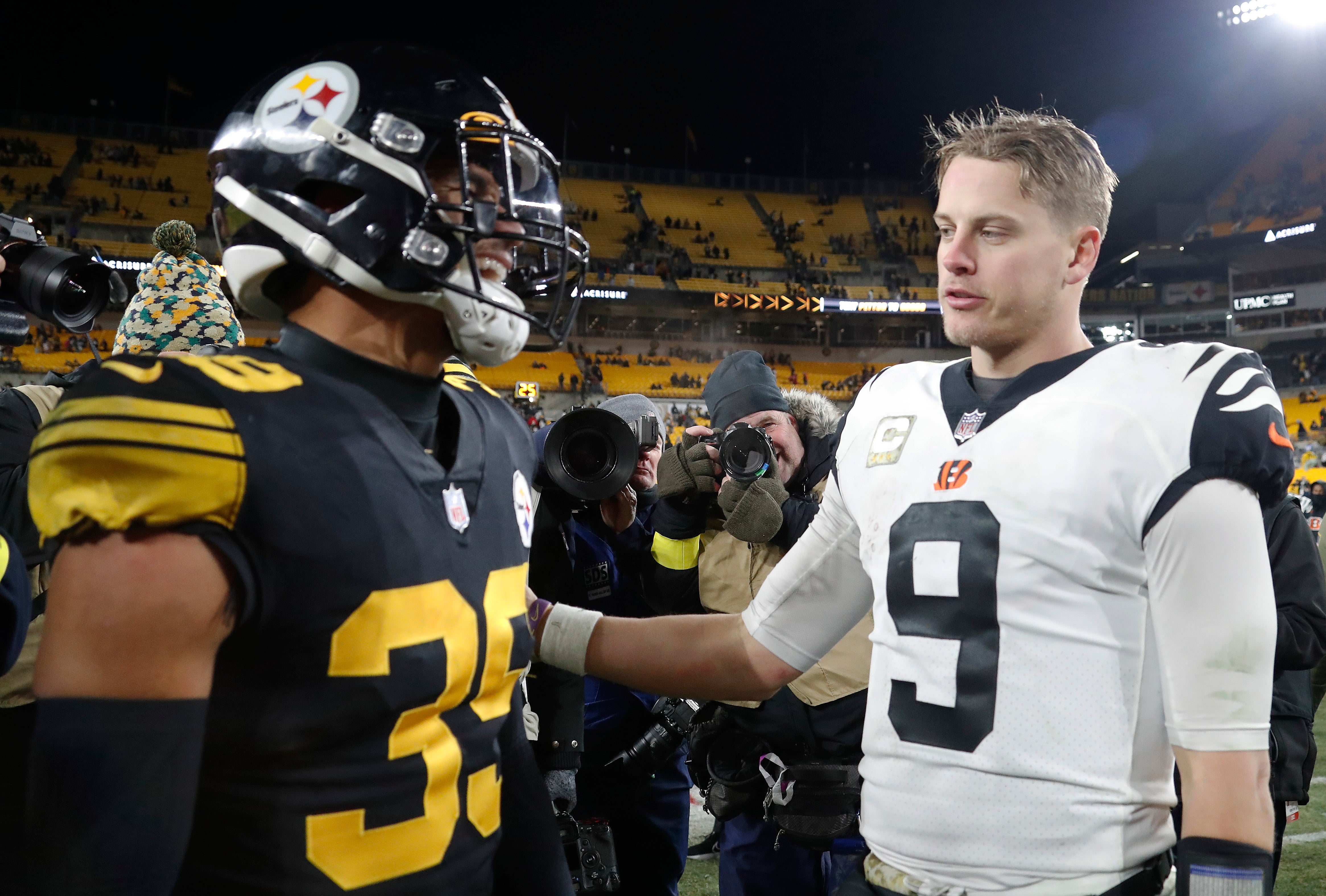 Nov 20, 2022; Pittsburgh, Pennsylvania, USA; Pittsburgh Steelers safety Minkah Fitzpatrick (39) and Cincinnati Bengals quarterback Joe Burrow (9) talk at mid-field after playing at Acrisure Stadium. The Bengals won 37-30.
