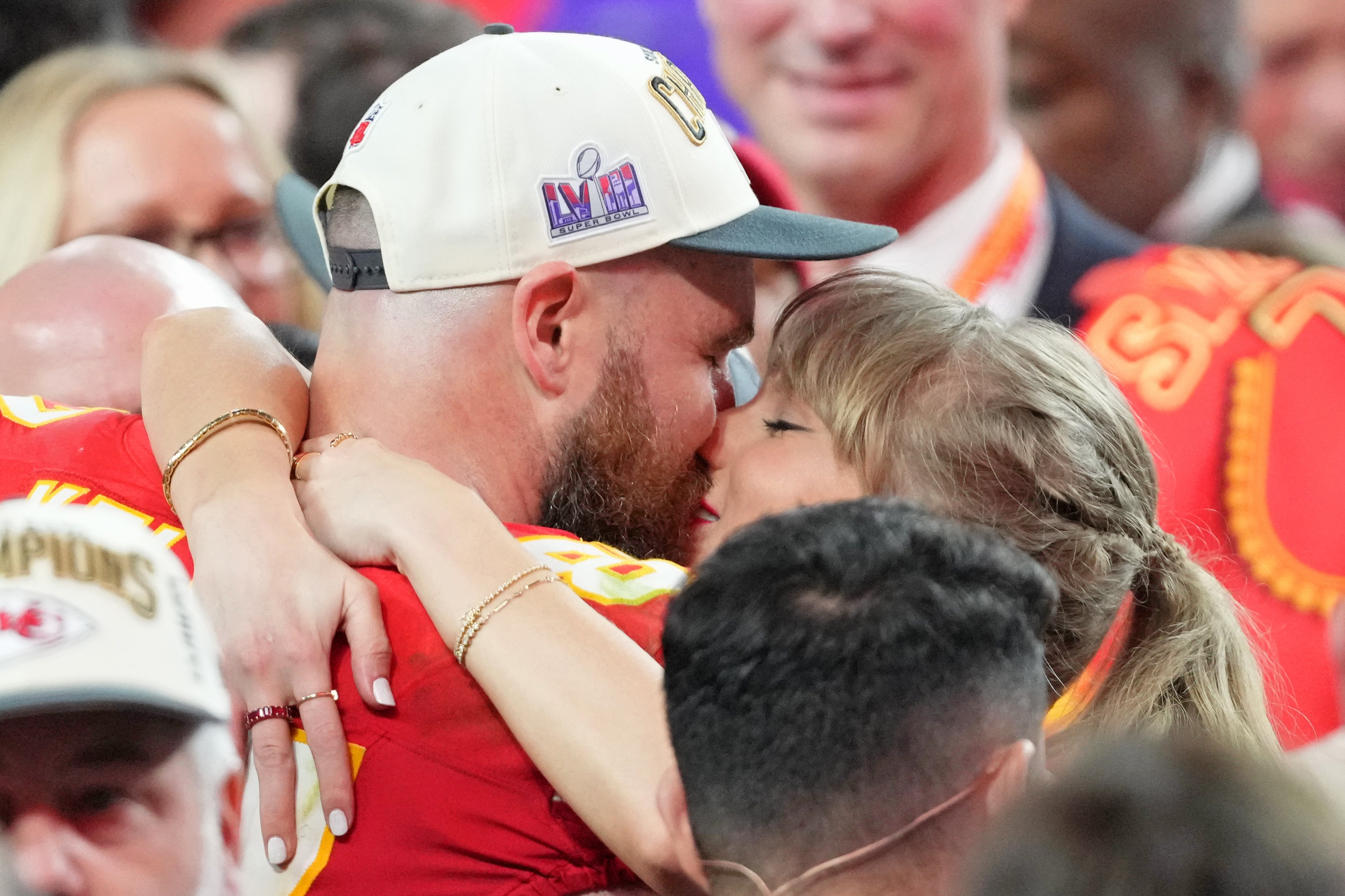 Feb 11, 2024; Paradise, Nevada, USA; Kansas City Chiefs tight end Travis Kelce (87) kisses Recording artist Taylor Swift after winning Super Bowl LVIII against the San Francisco 49ers at Allegiant Stadium.