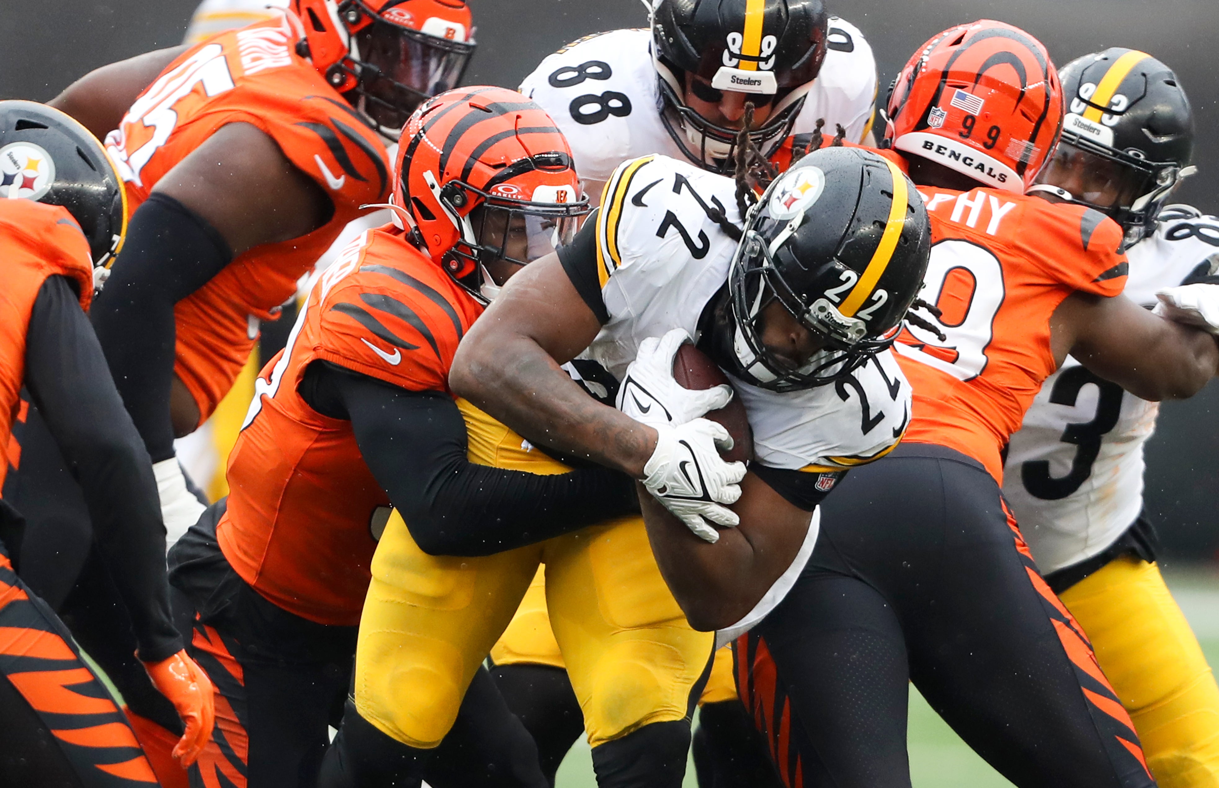 Nov 26, 2023; Cincinnati, Ohio, USA; Pittsburgh Steelers running back Najee Harris (22) runs the ball as Cincinnati Bengals linebacker Akeem Davis-Gaither (59) makes the tackle during the second quarter at Paycor Stadium.