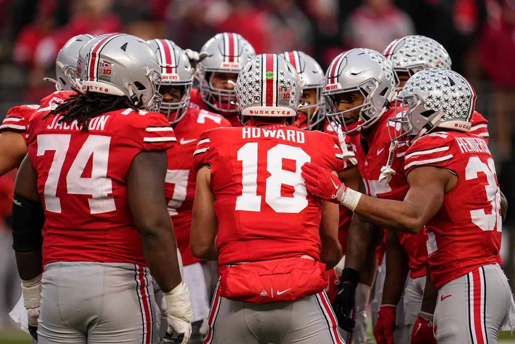 Ohio State Buckeyes quarterback Will Howard (18) talks to his team in the huddle during the NCAA football game against the Indiana Hoosiers at Ohio Stadium in Columbus on Monday, Nov. 25, 2024.