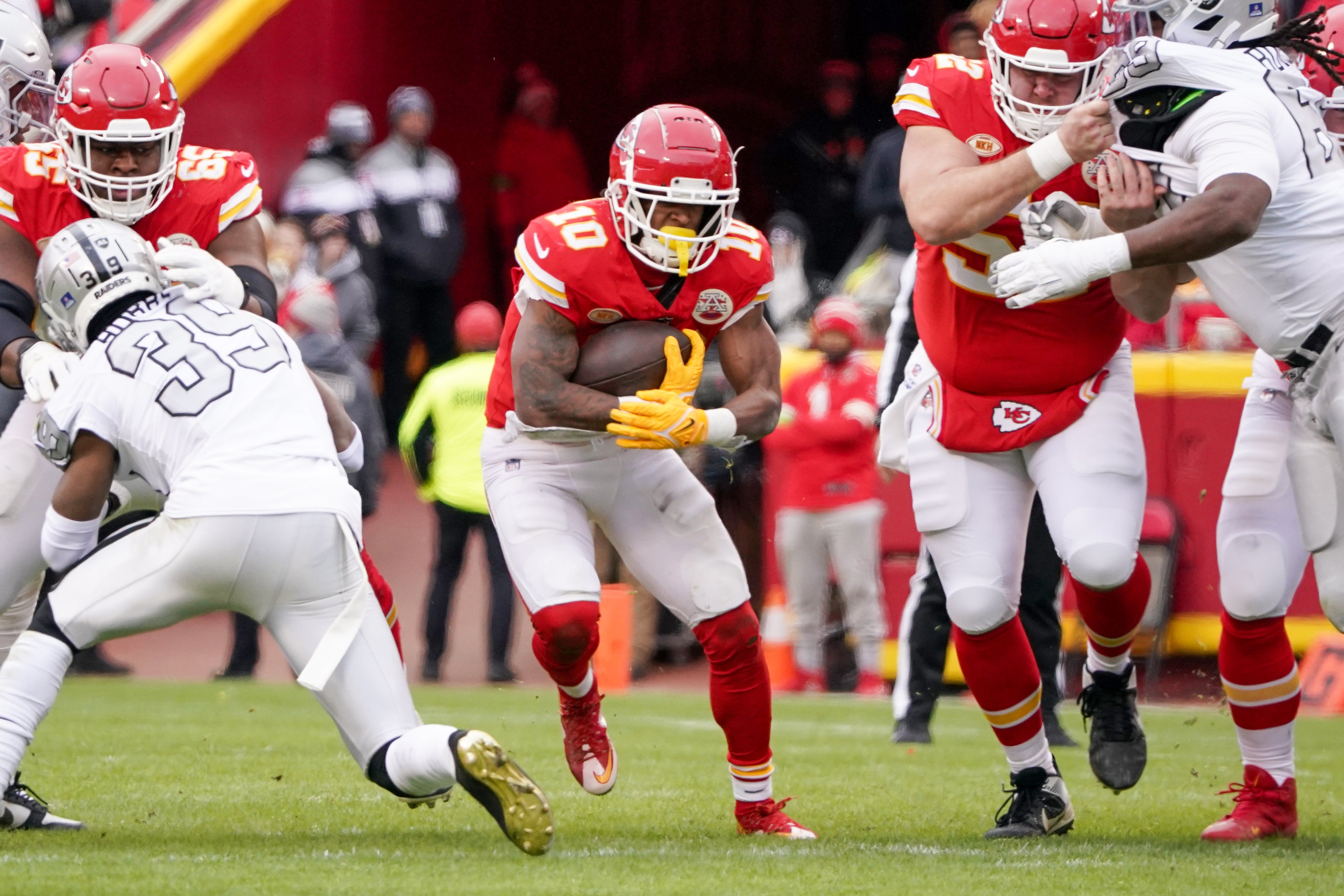 Dec 25, 2023; Kansas City, Missouri, USA; Kansas City Chiefs running back Isiah Pacheco (10) runs the ball against the Las Vegas Raiders during the first half at GEHA Field at Arrowhead Stadium.