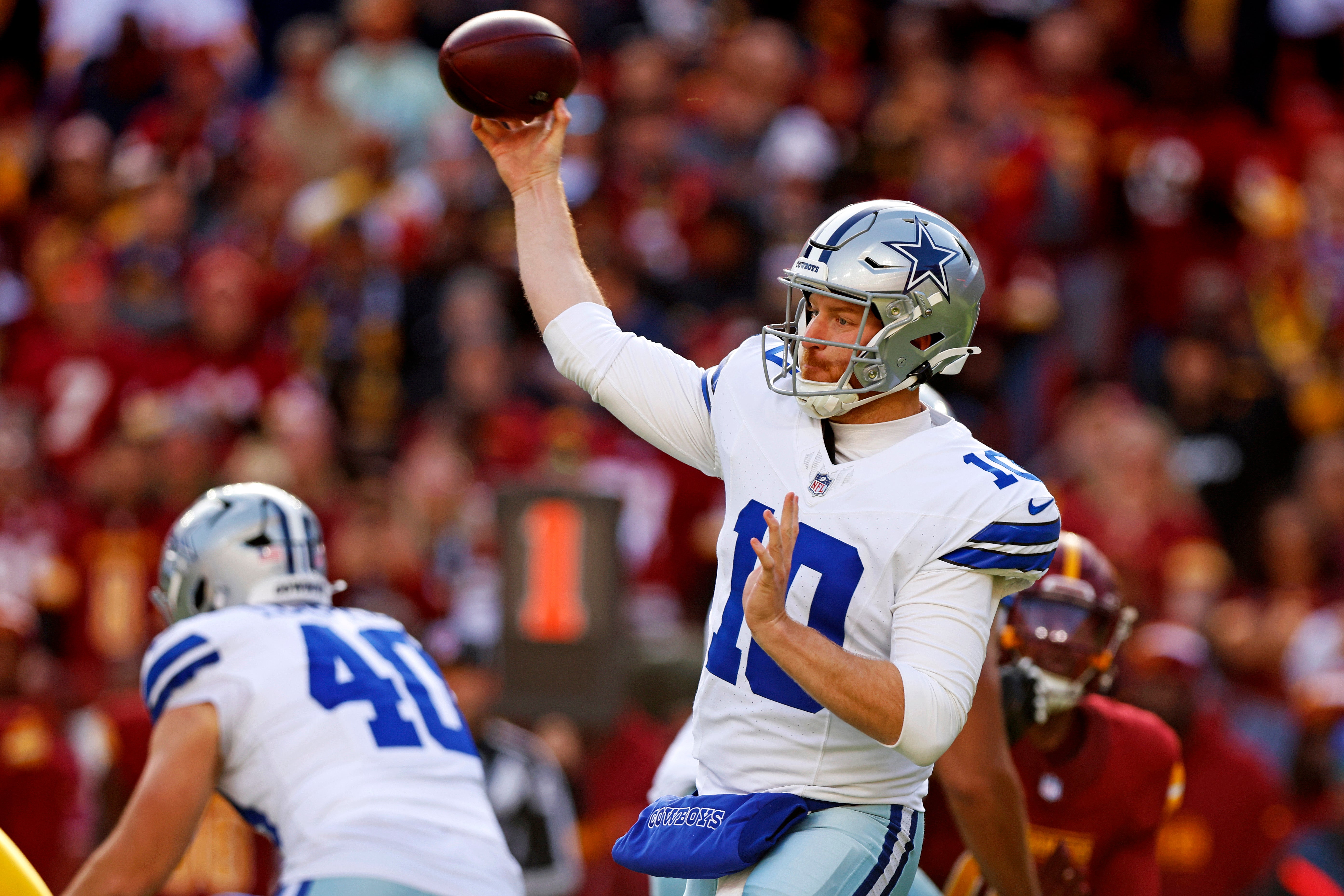 Dallas Cowboys quarterback Cooper Rush (10) throws a pass during the first quarter against the Washington Commanders at Northwest Stadium.