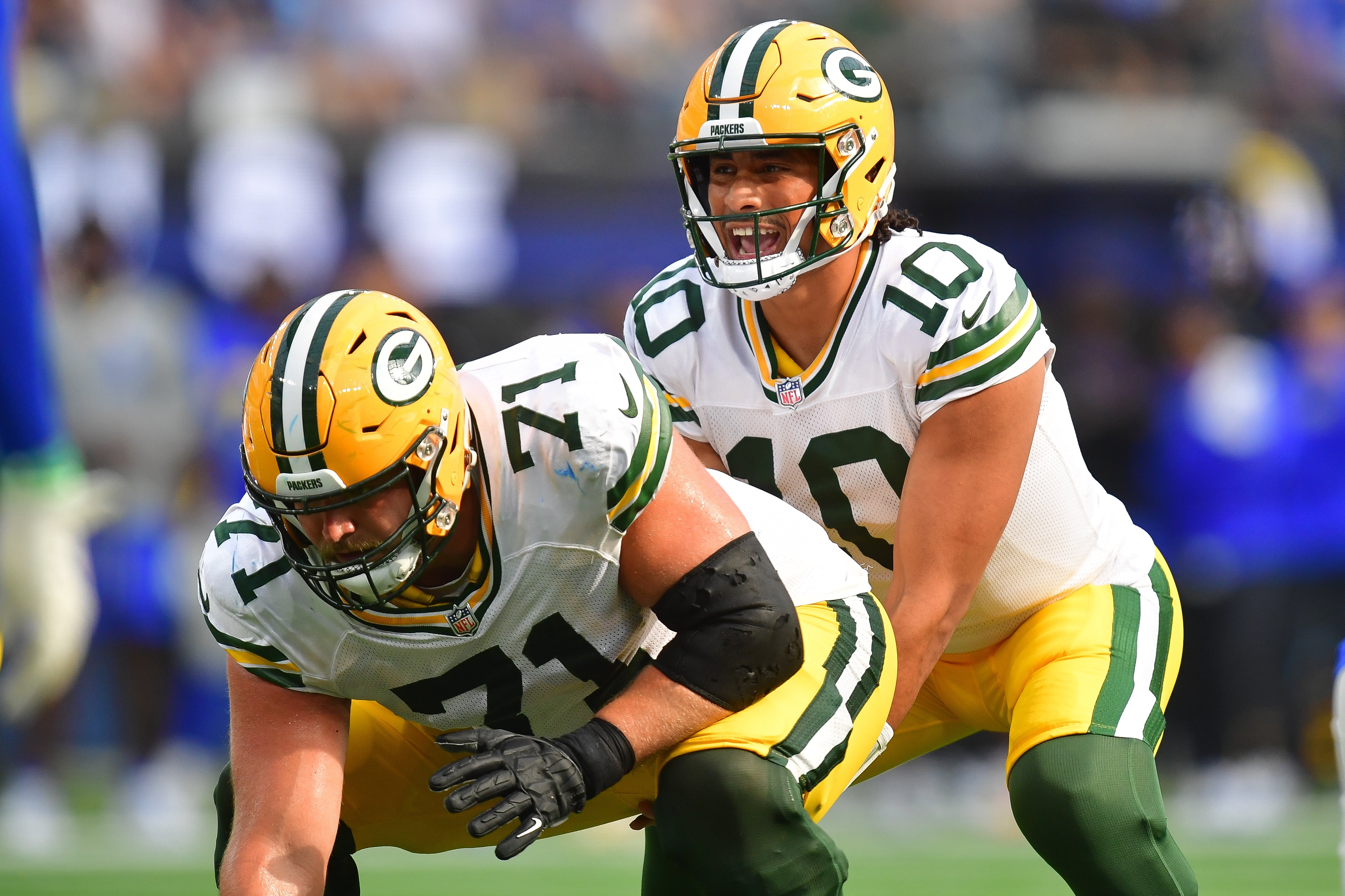 Green Bay Packers quarterback Jordan Love (10) under center with center Josh Myers (71) against the Los Angeles Rams during the second half at SoFi Stadium.
