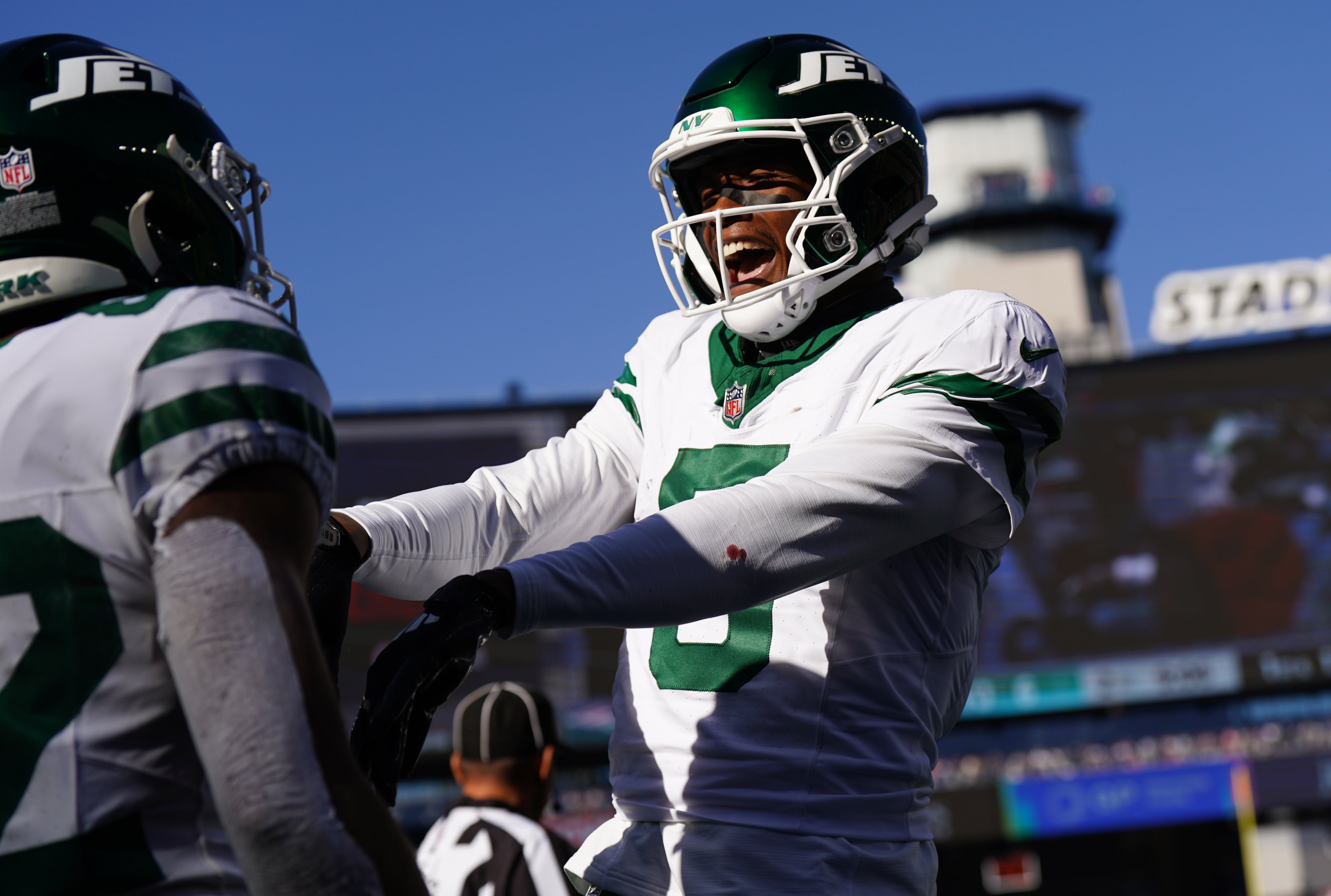 New York Jets wide receiver Garrett Wilson (5) congratulates wide receiver Xavier Gipson (82) after his touchdown against the New England Patriots in the second quarter at Gillette Stadium.