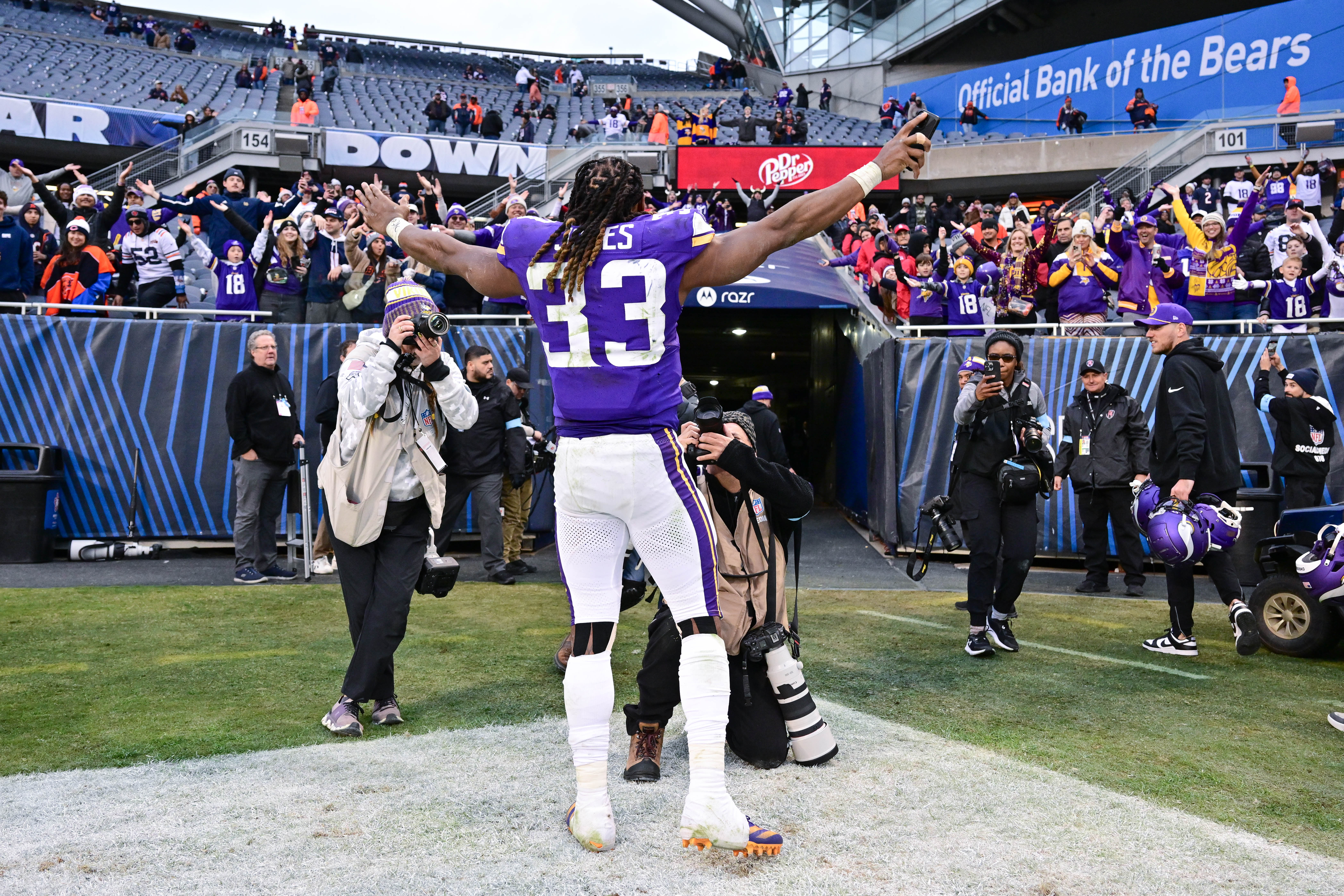 Nov 24, 2024; Chicago, Illinois, USA; Minnesota Vikings running back Aaron Jones (33) celebrates after the game against the Chicago Bears at Soldier Field.