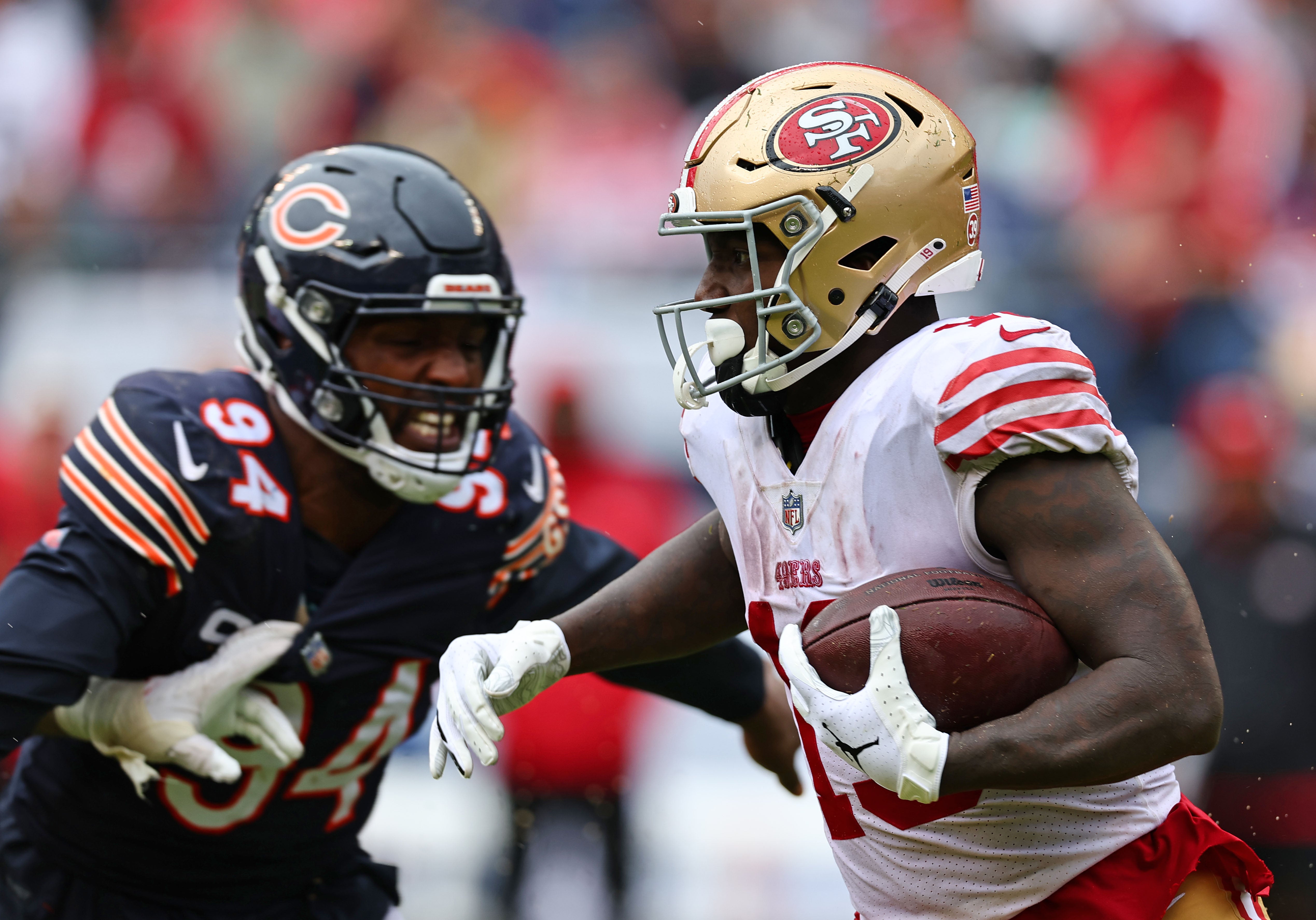 San Francisco 49ers wide receiver Jauan Jennings (15) runs the ball after a catch against the Chicago Bears during the second half at Soldier Field.